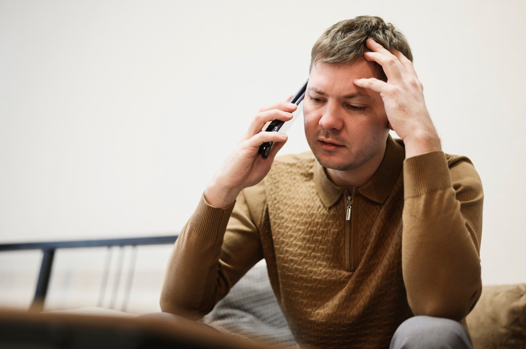 A serious man talking on his phone | Source: Freepik