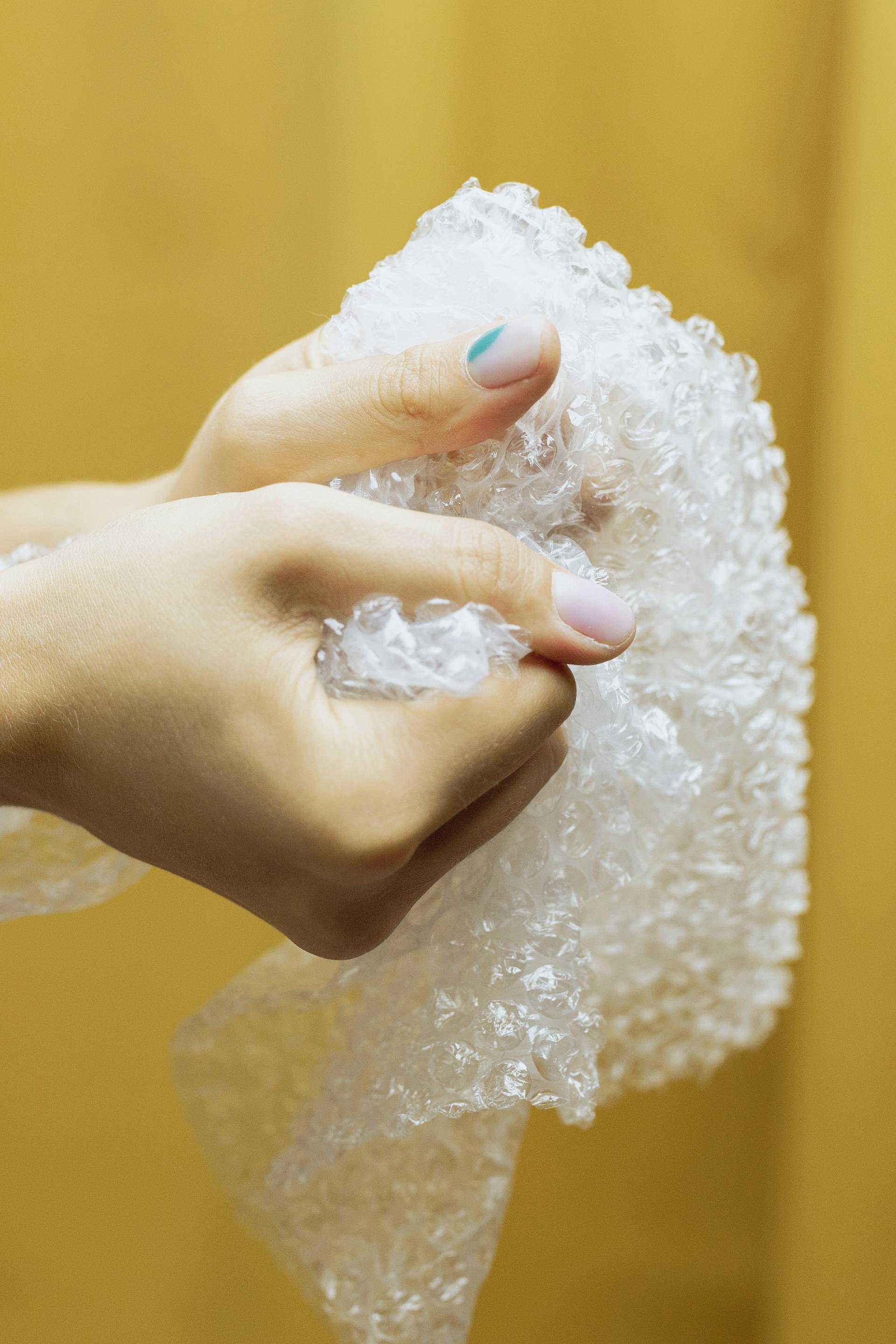 A woman holding a bubble wrap | Source: Pexels