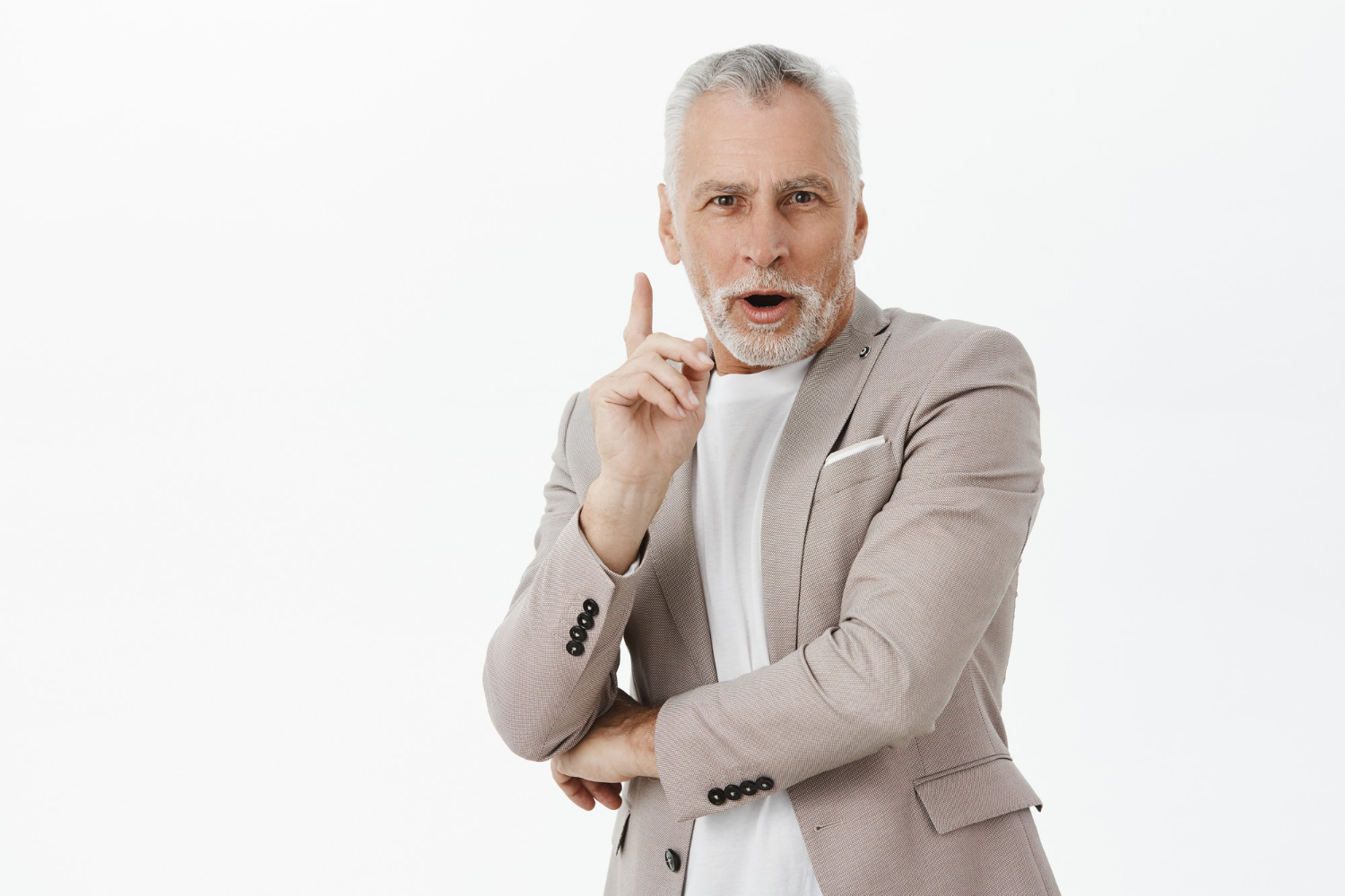 A senior man raising his finger | Source: Freepik