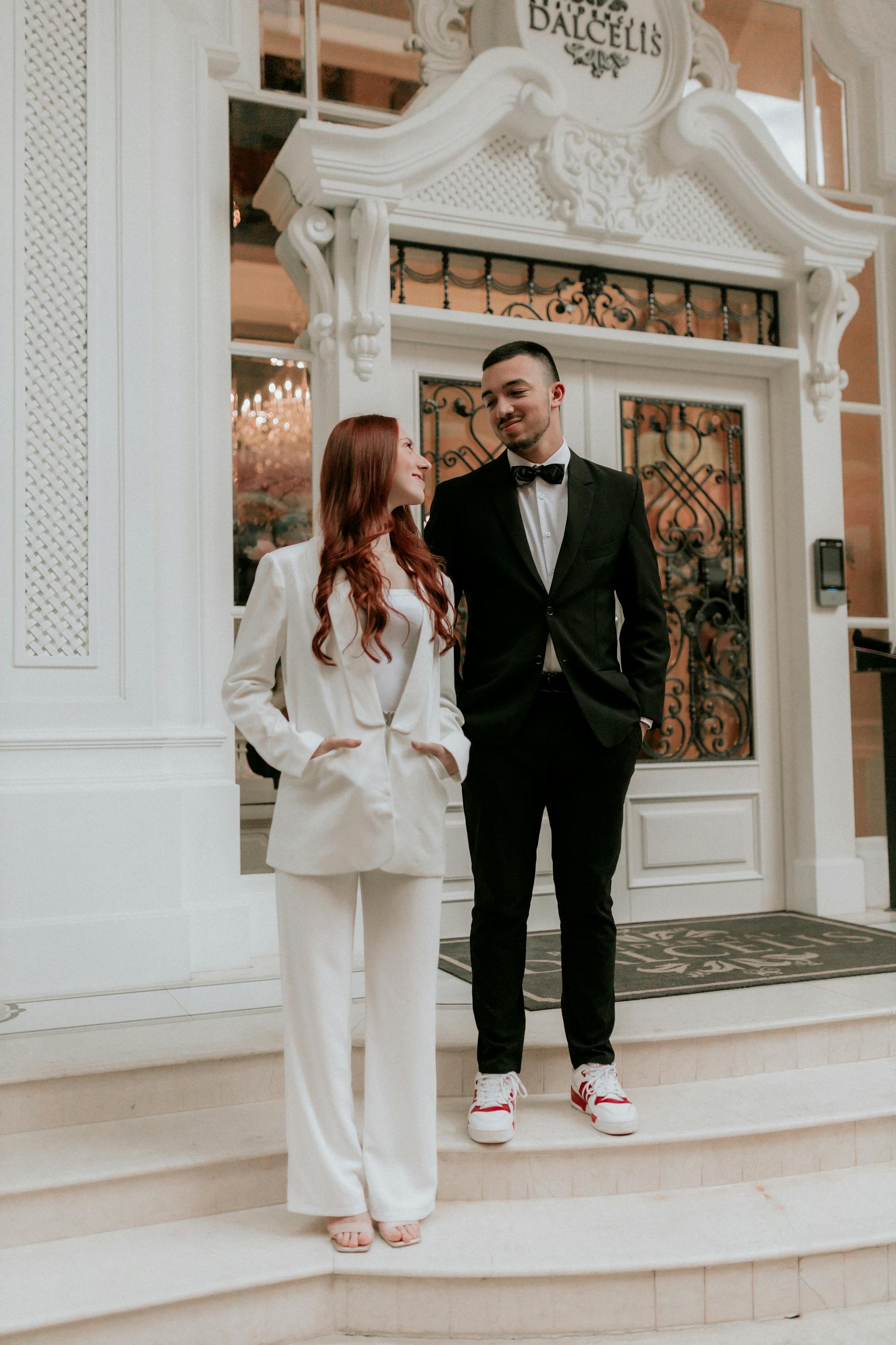 A couple at the entrance of an establishment | Source: Pexels