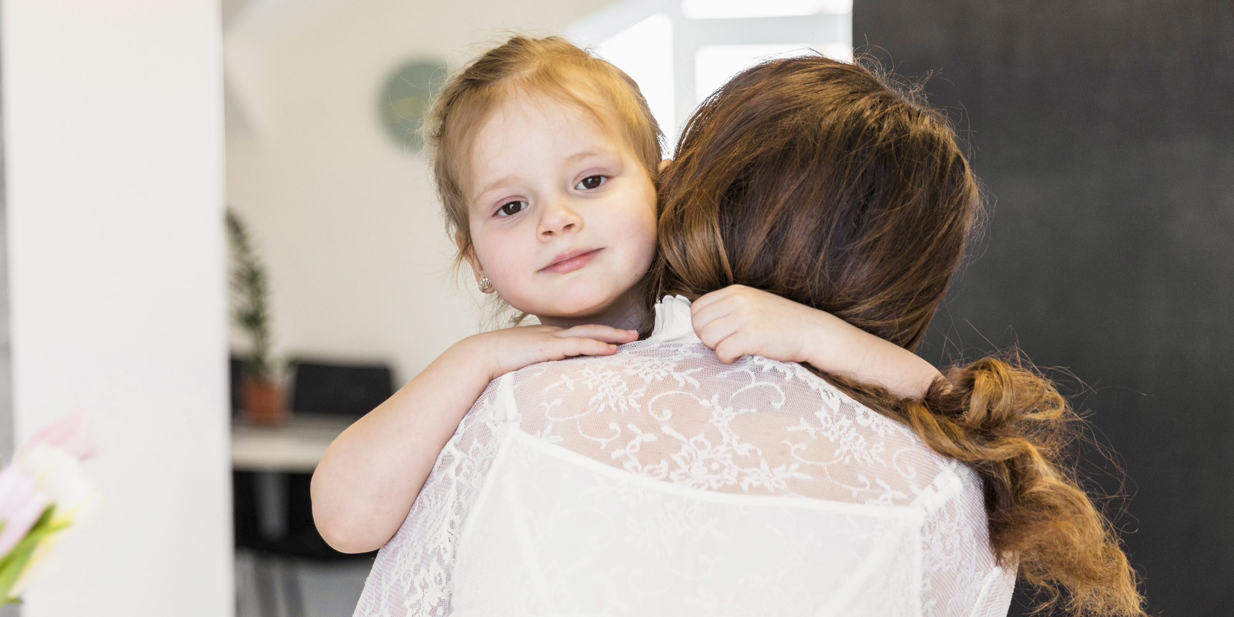 A woman hugging a child | Source: Freepik