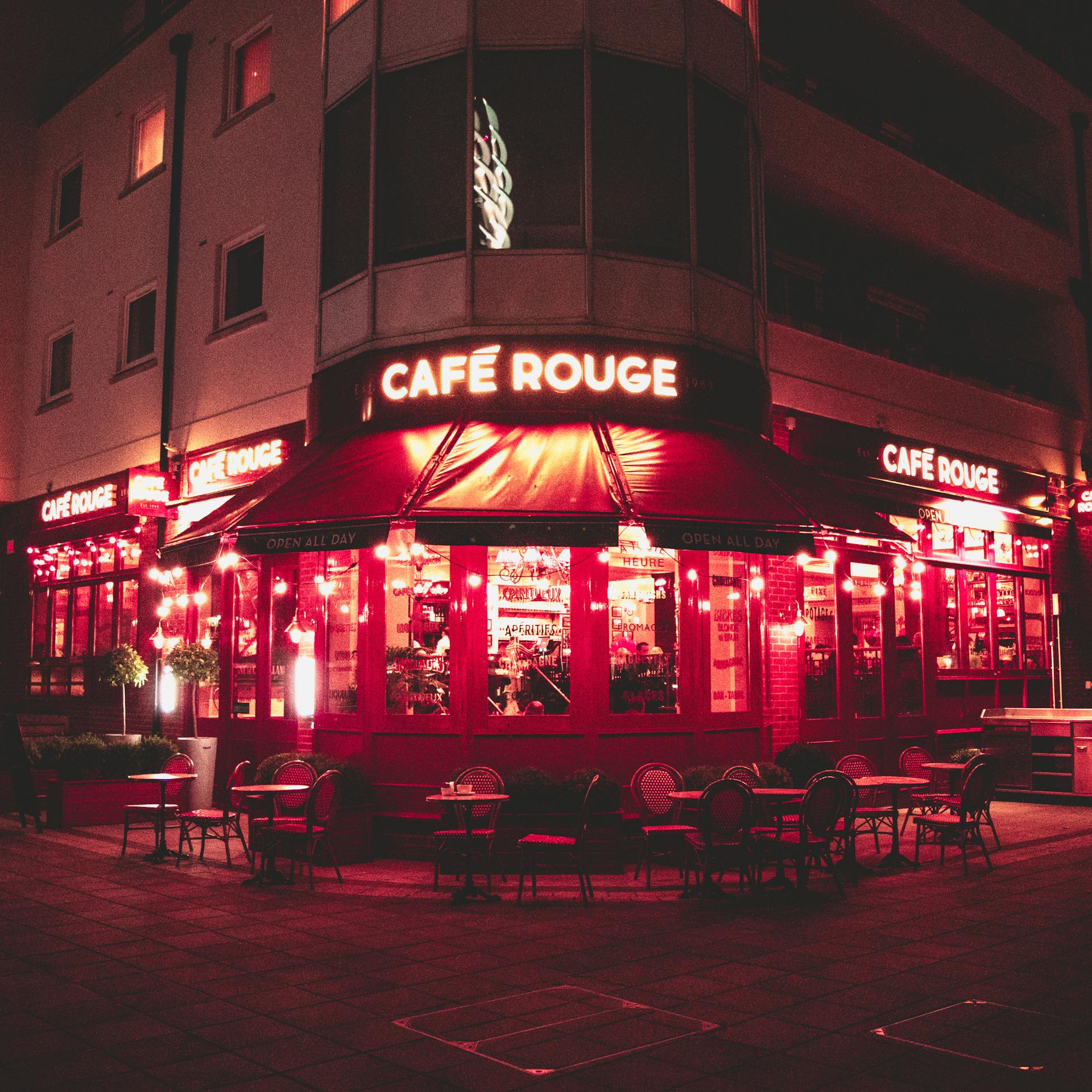 The exterior of a café on the street during nighttime | Source: Pexels