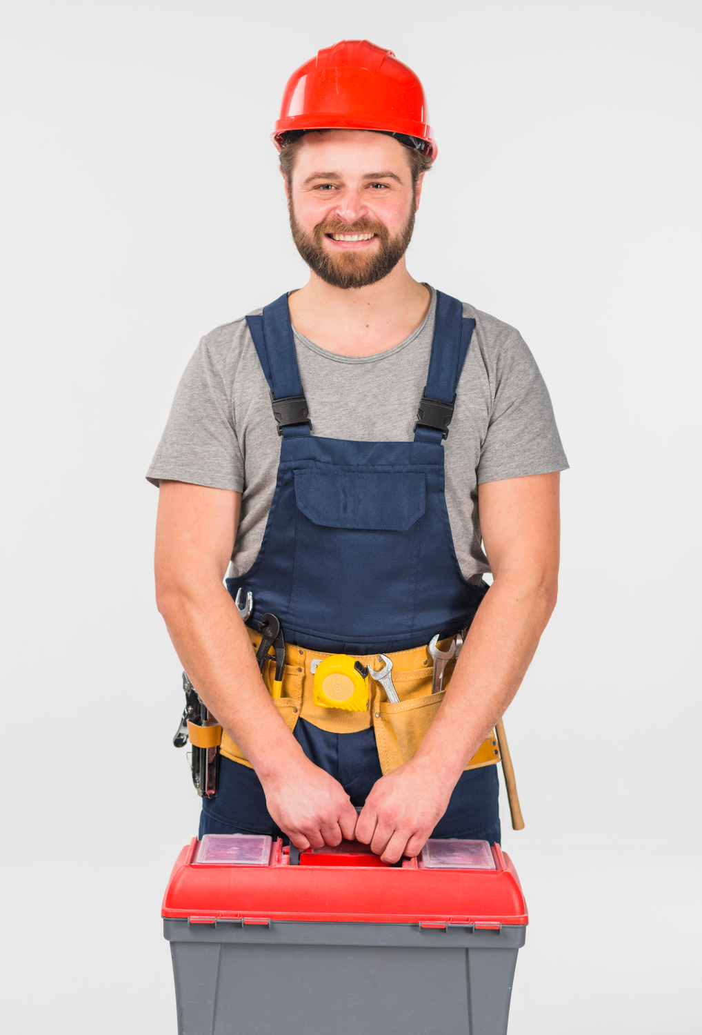 A man holding a toolkit | Source: Freepik