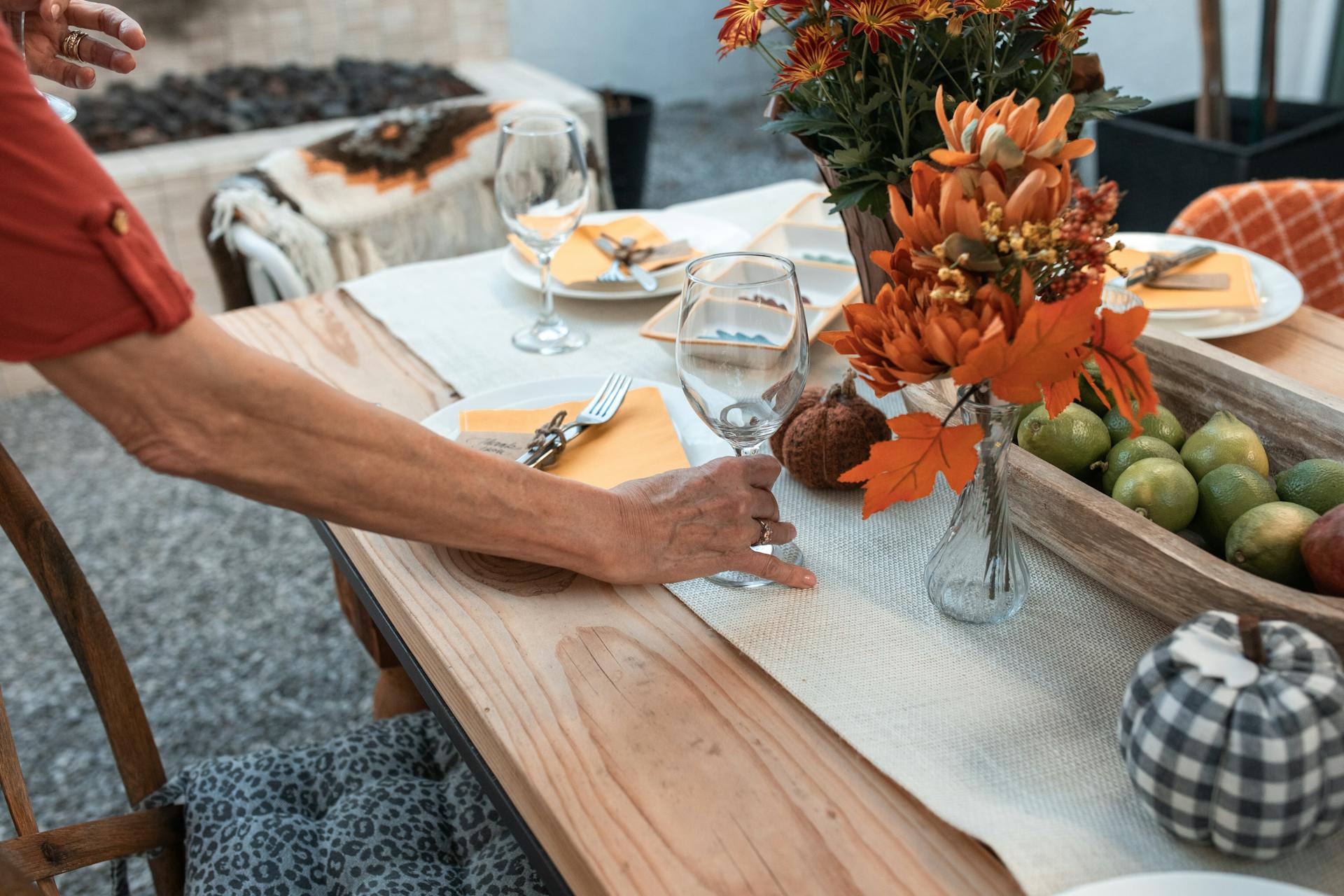 An older woman inspecting a table | Source: Pexels