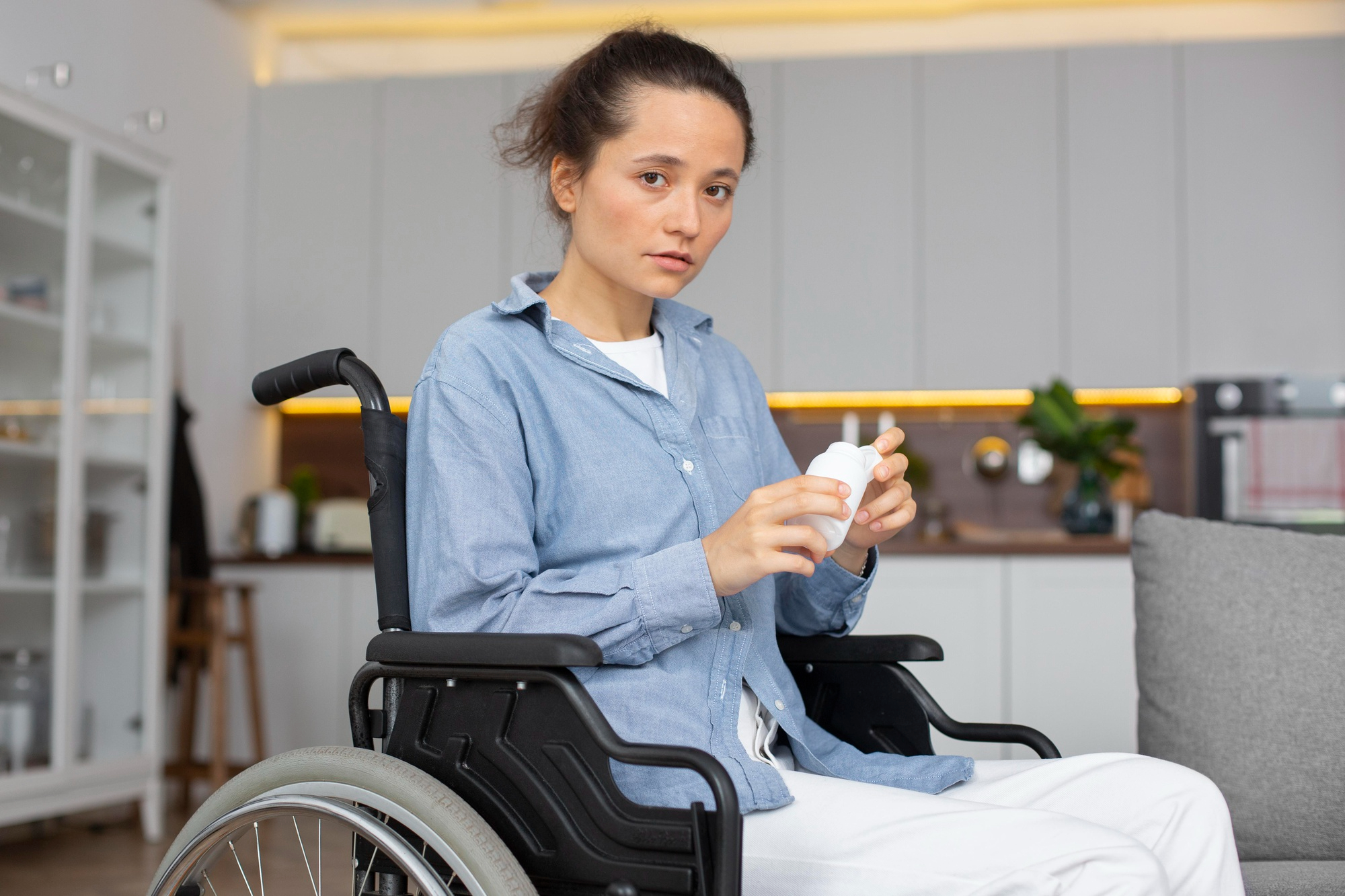 A woman in a wheelchair | Source: Freepik