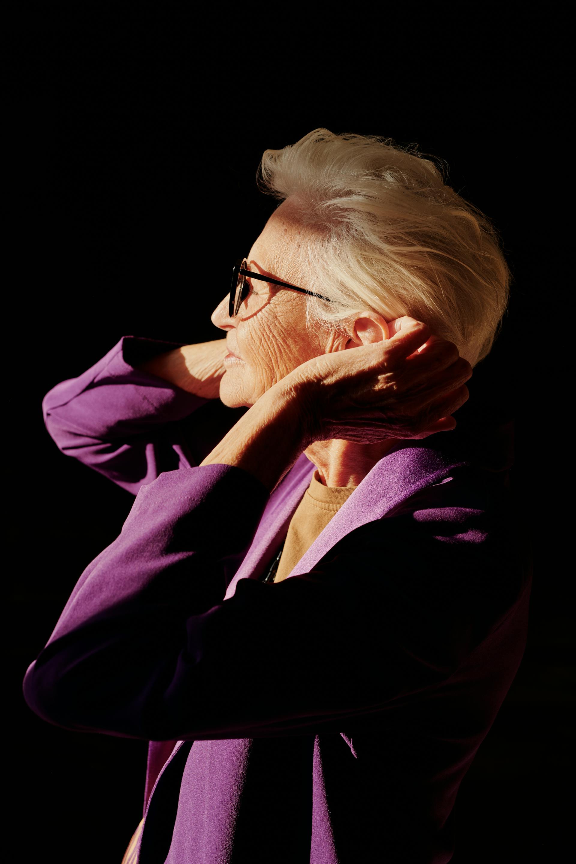 A woman fixing her hair | Source: Pexels