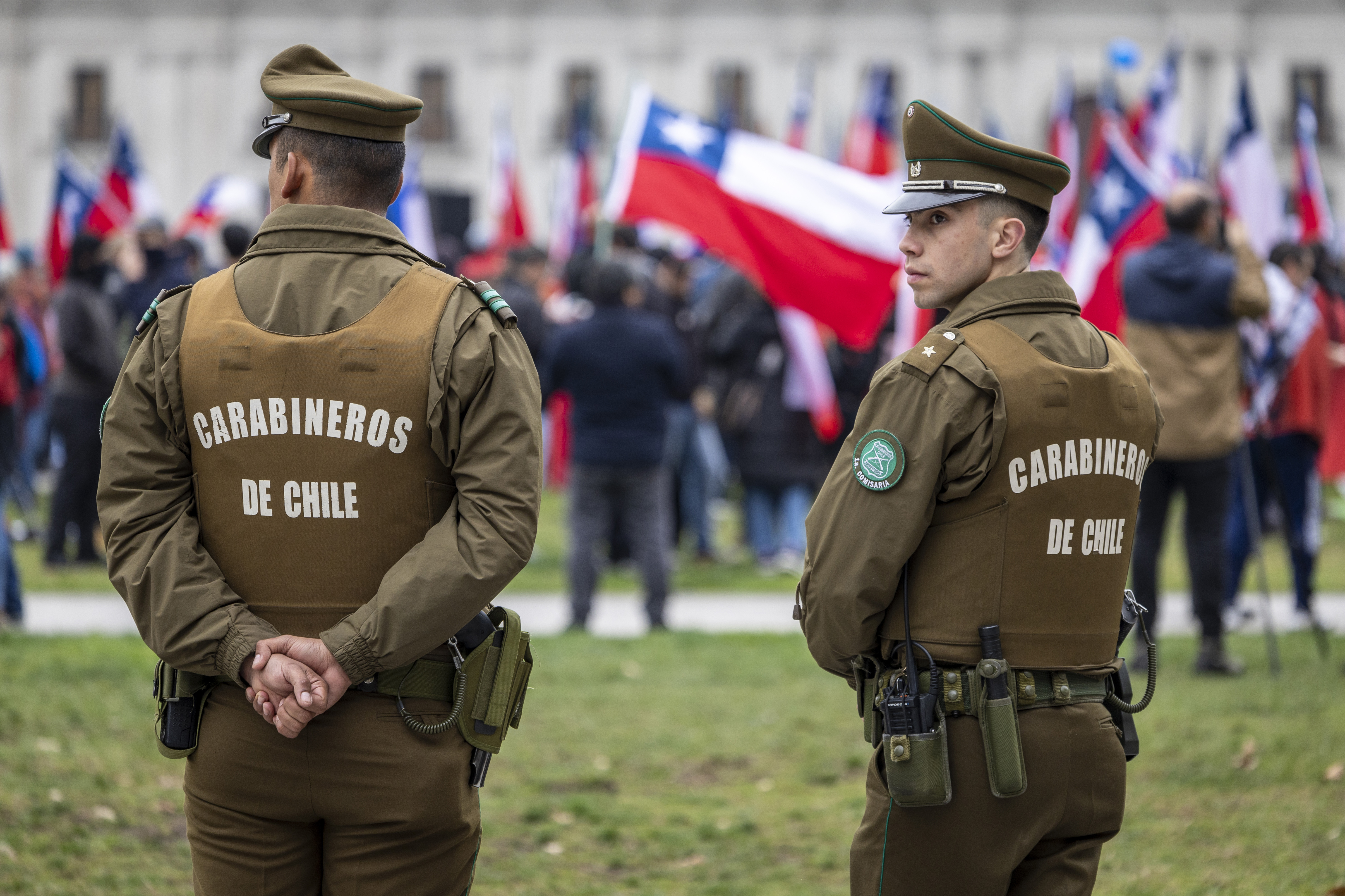 Chilean carabinero police watch over a right-wing protest in front of La Moneda presidential palace ahead of the 50th anniversary of the coup d'etat on September 9, 2023, in Santiago, Chile. | Source: Getty Images