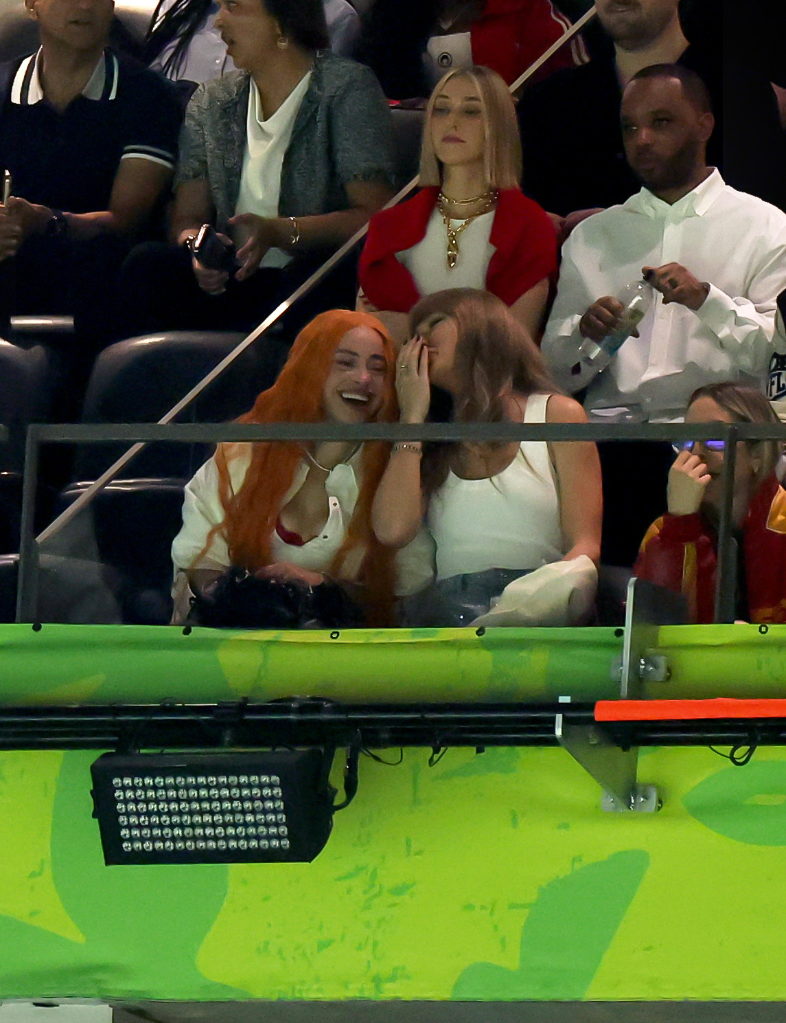 Taylor Swift chats with Ice Spice and Ashley Avignone during Super Bowl LIX at Caesars Superdome on February 9, 2025 | Source: Getty Images