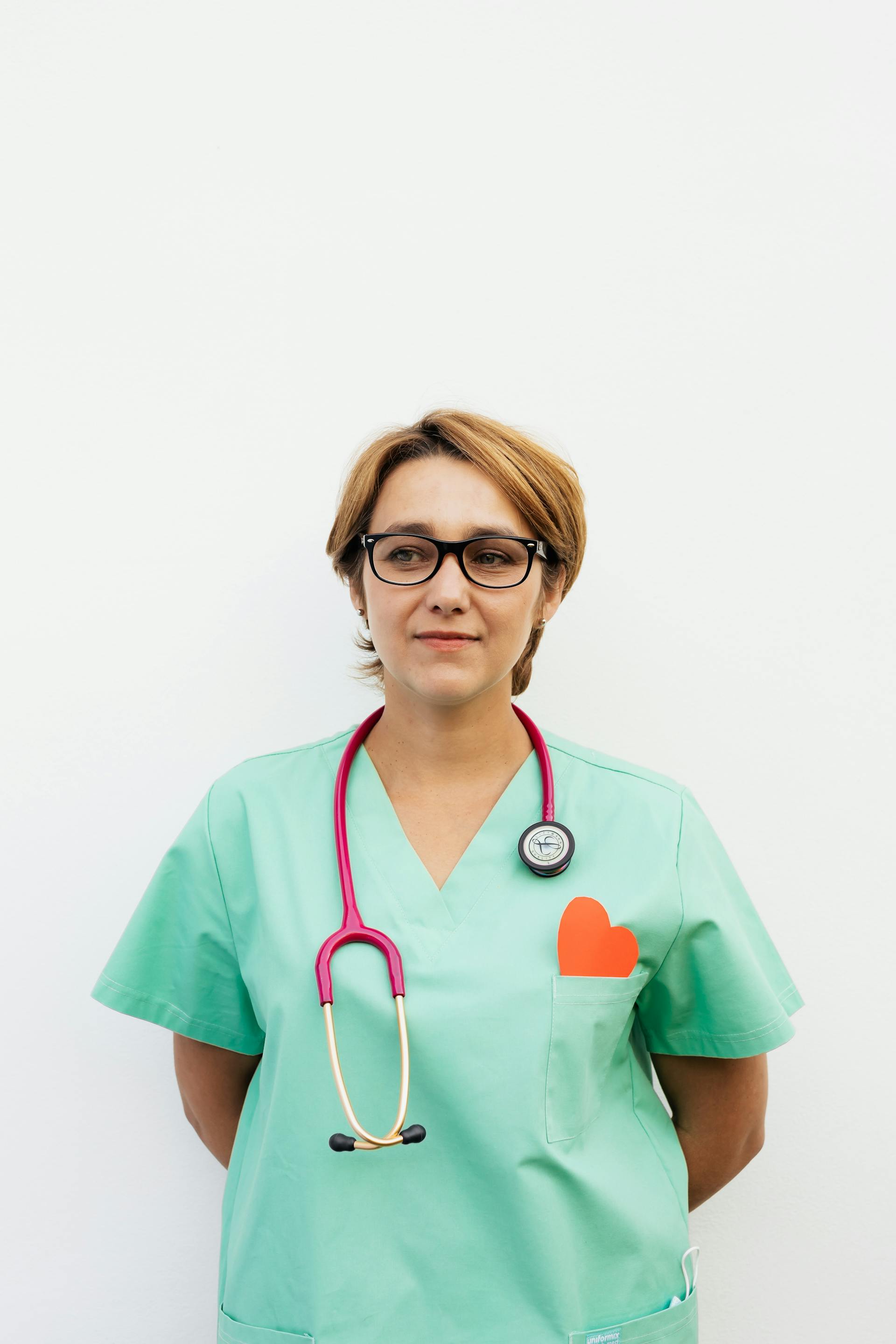 A female nurse in green scrubs | Source: Pexels