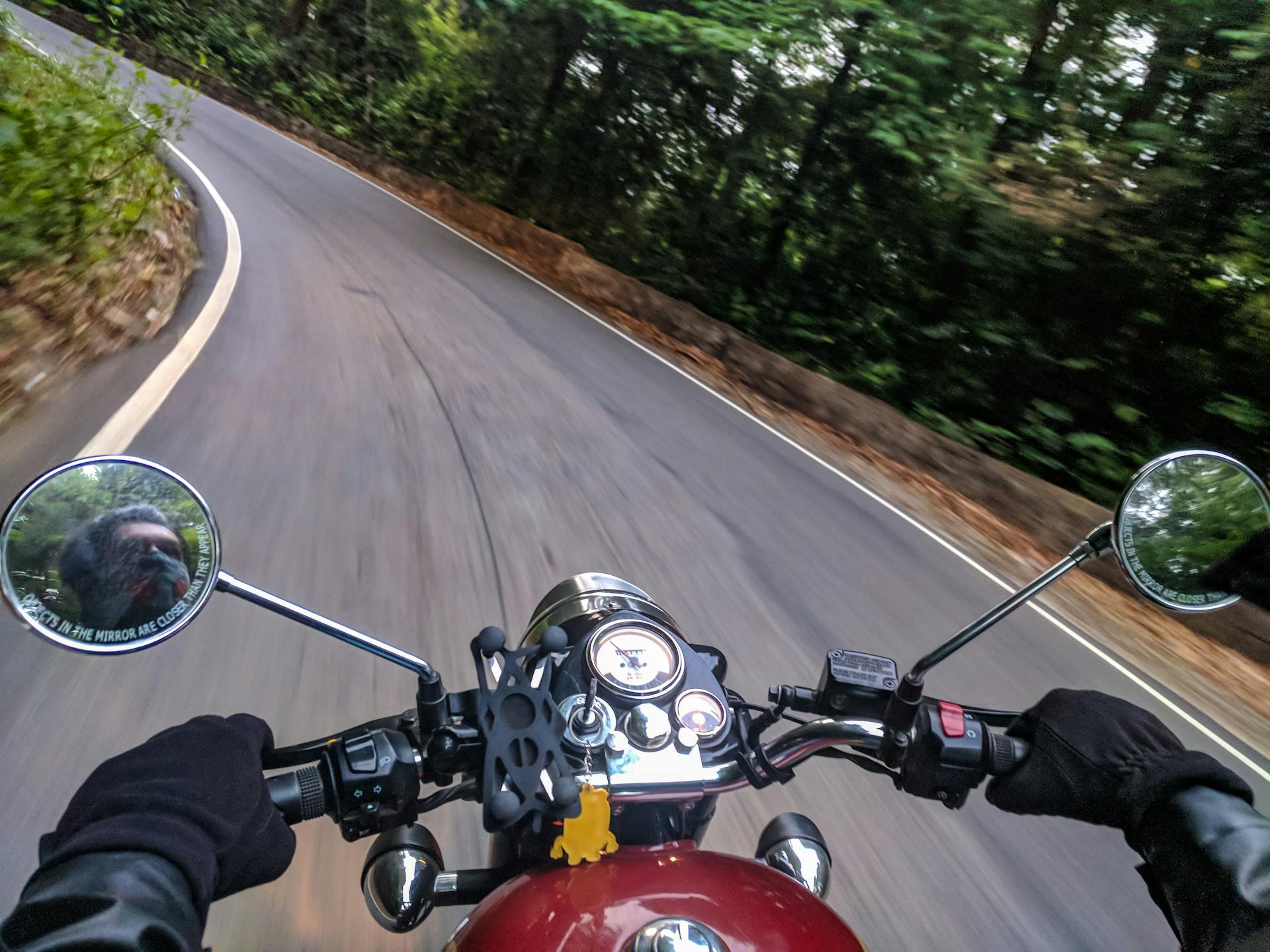 A motorcyclist driving on a road | Source: Pexels