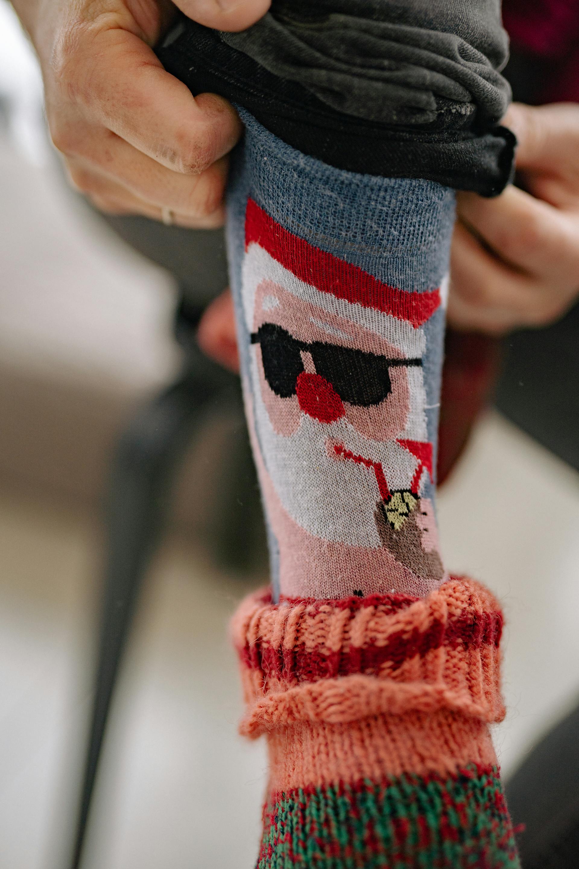 A man wearing funny novelty socks | Source: Pexels