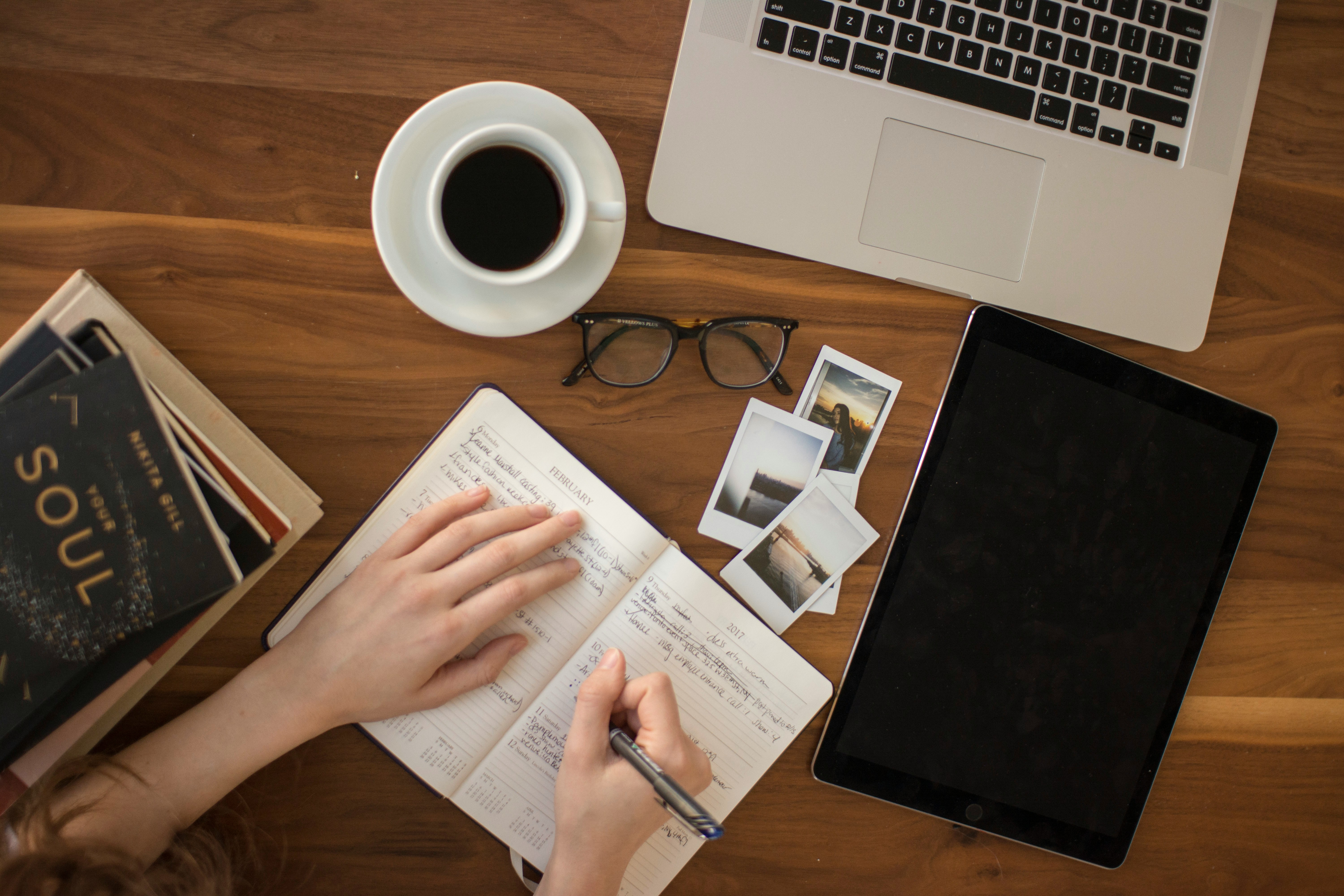 A girl writing something in her diary | Source: Unsplash