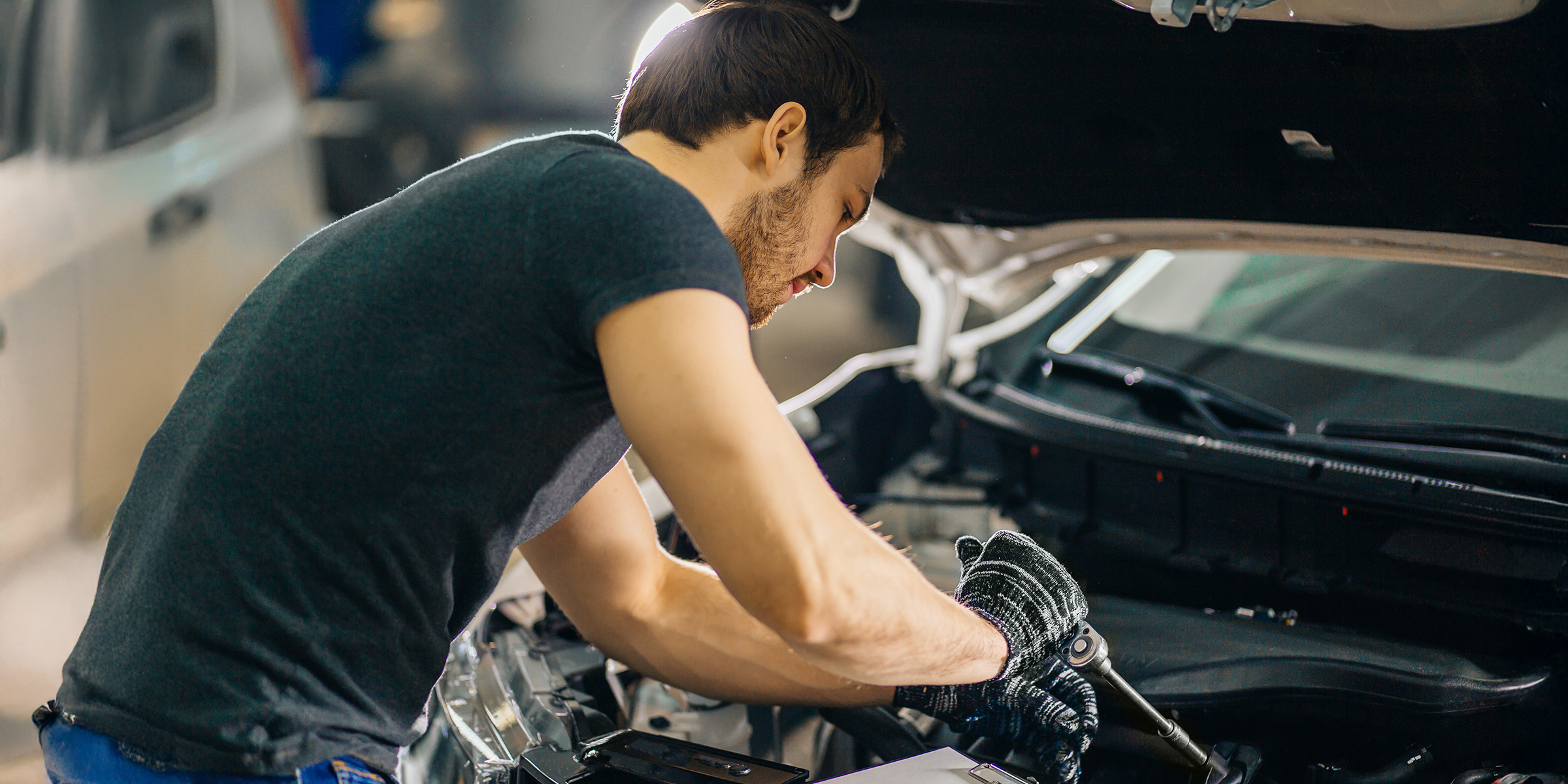 Man fixing a car | Source: Shutterstock