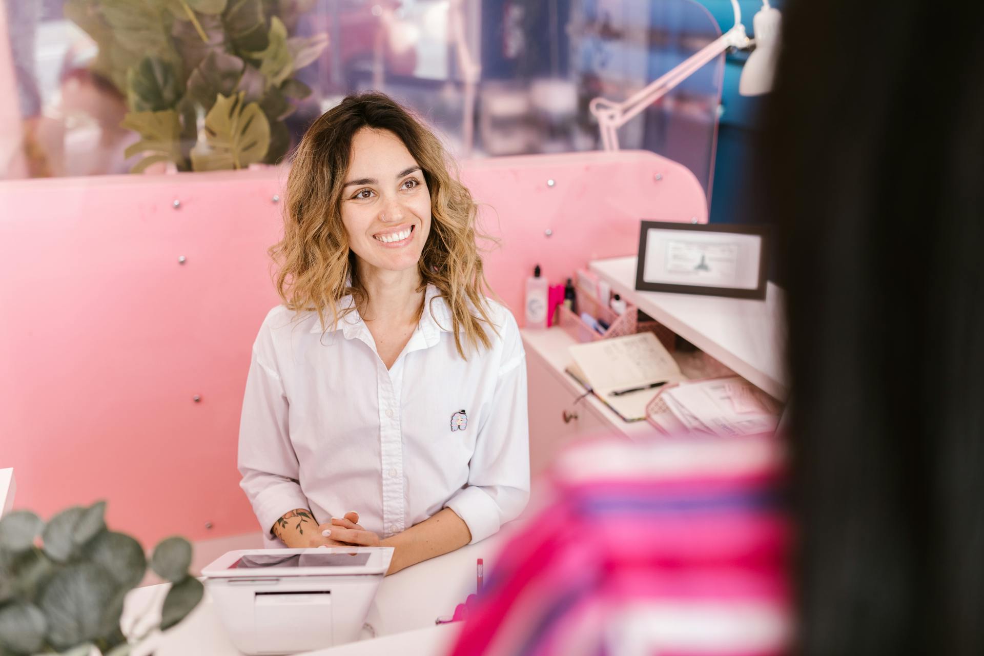 A smiling receptionist in a spa | Source: Pexels