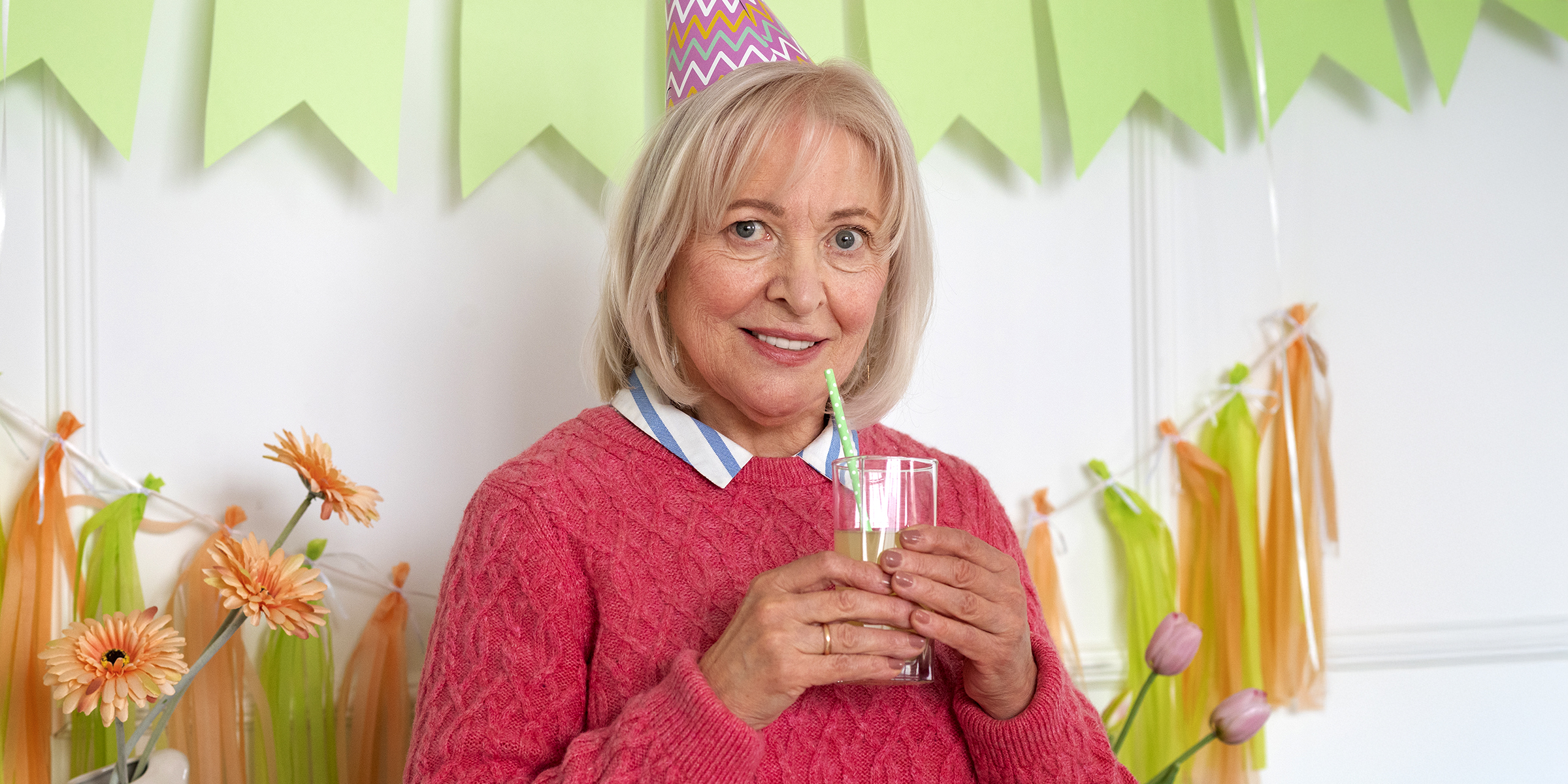A woman attending a birthday celebration | Source: Freepik