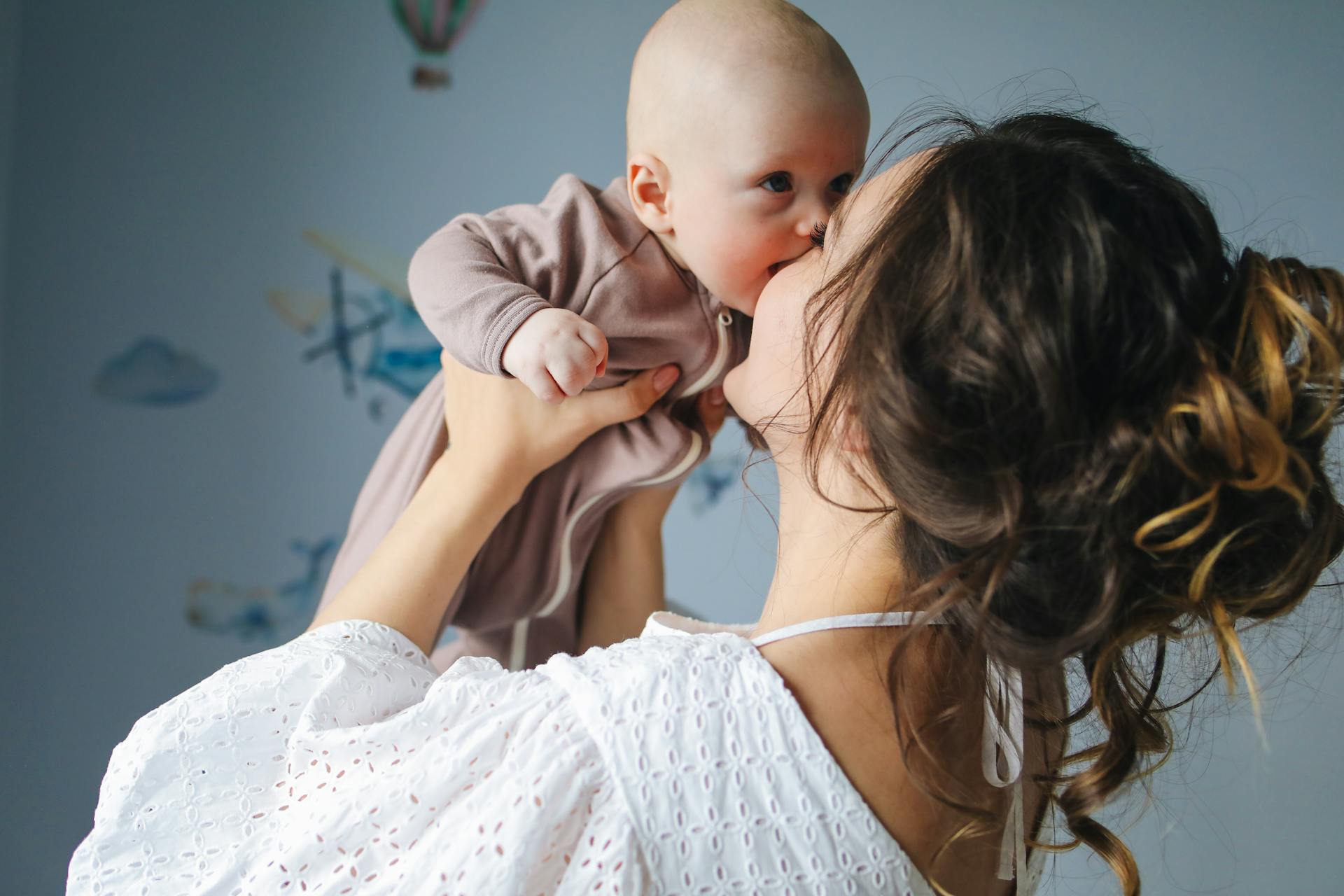 A woman holding a baby | Source: Pexels