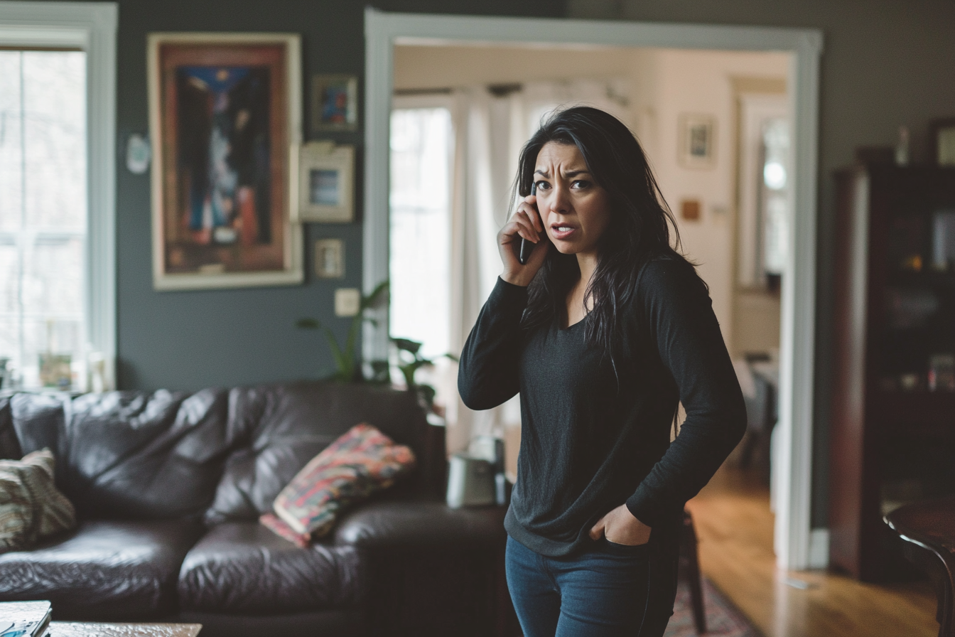 A woman pacing her living room while speaking on her phone | Source: Midjourney