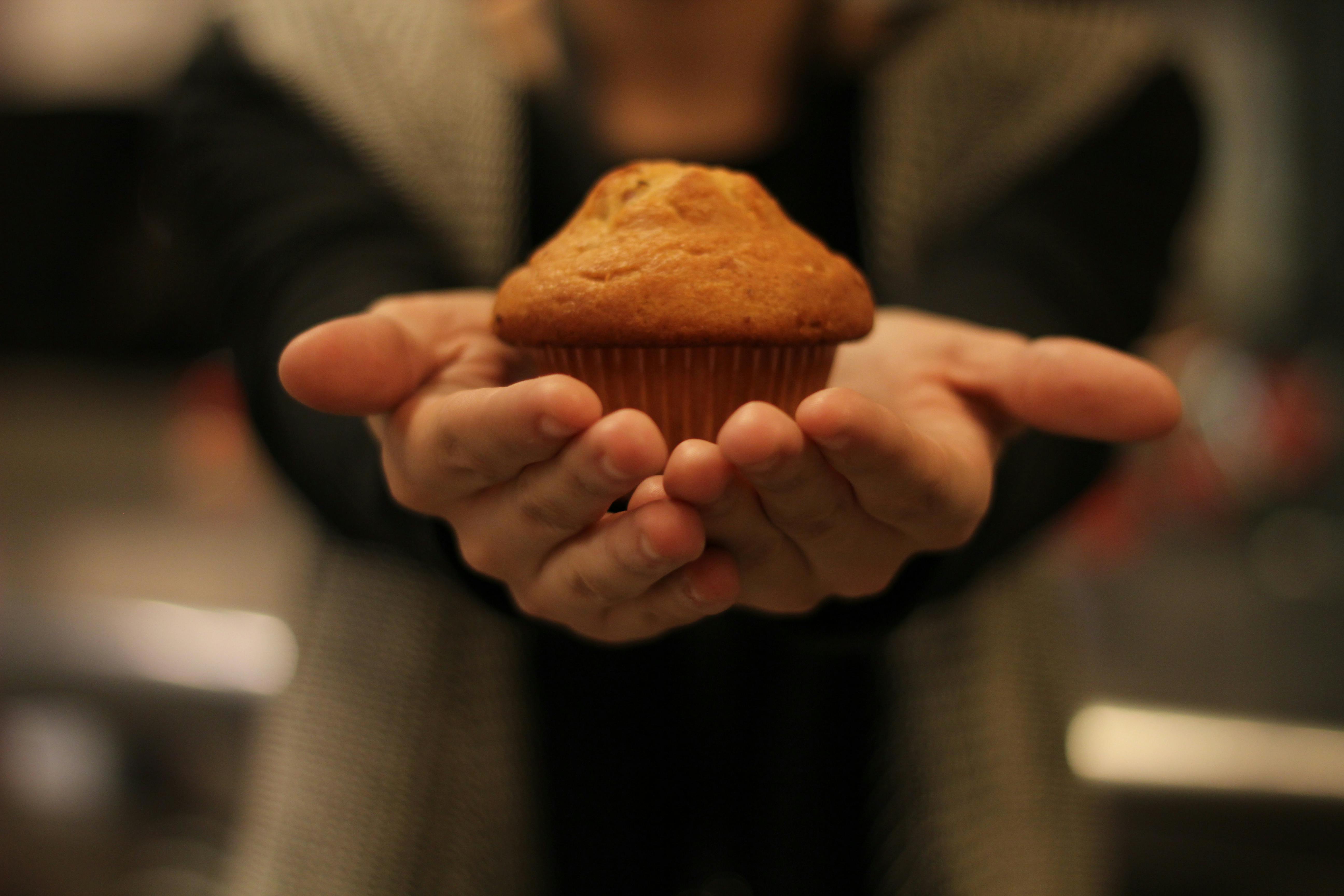 A man presenting a muffin | Source: Pexels