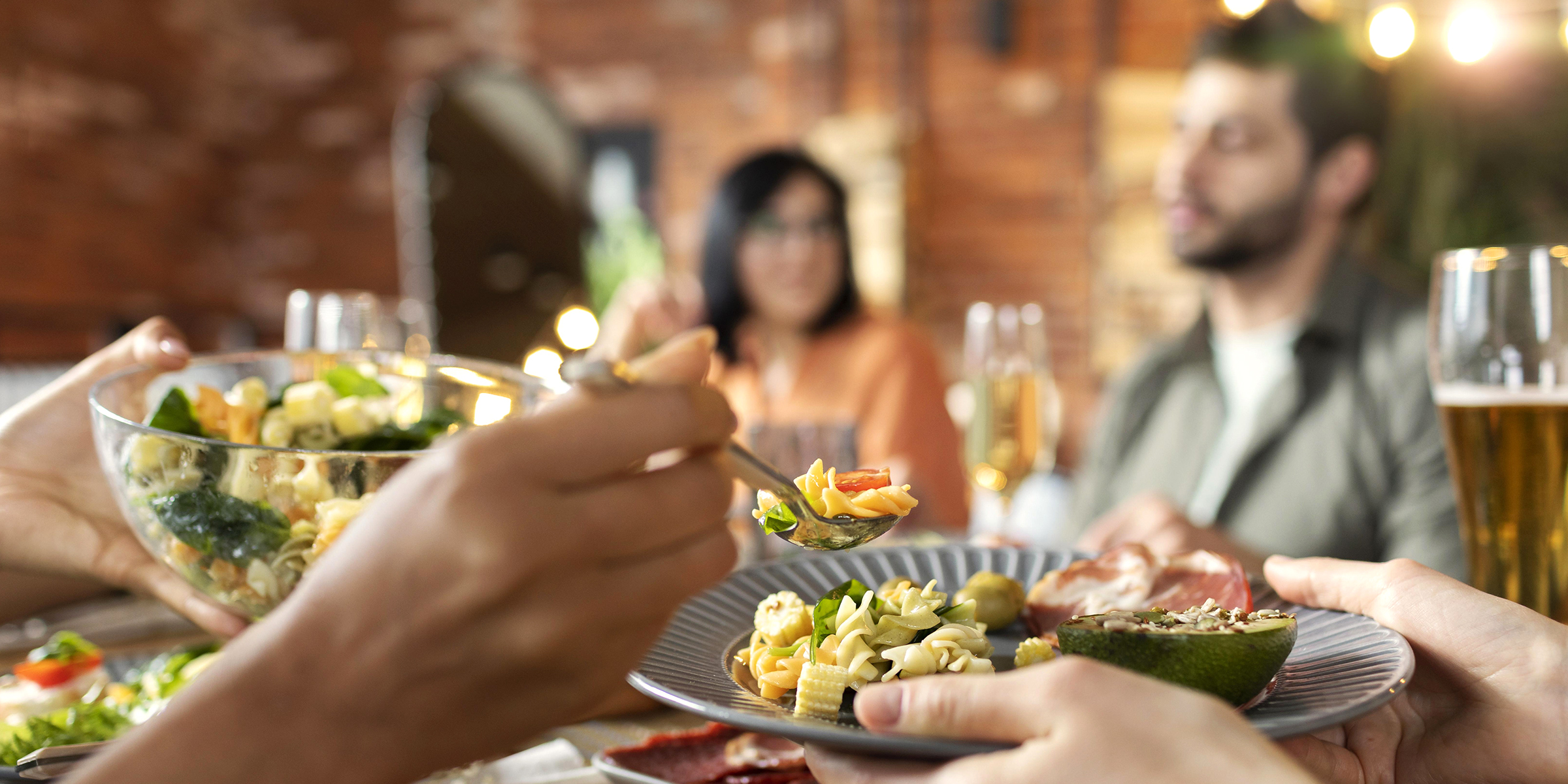 People sitting at a dinner table | Source: Freepik
