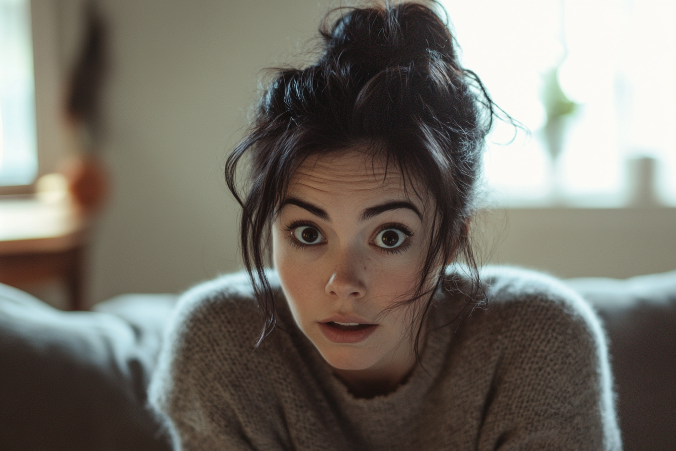 A shocked woman in an apartment living room | Source: Midjourney