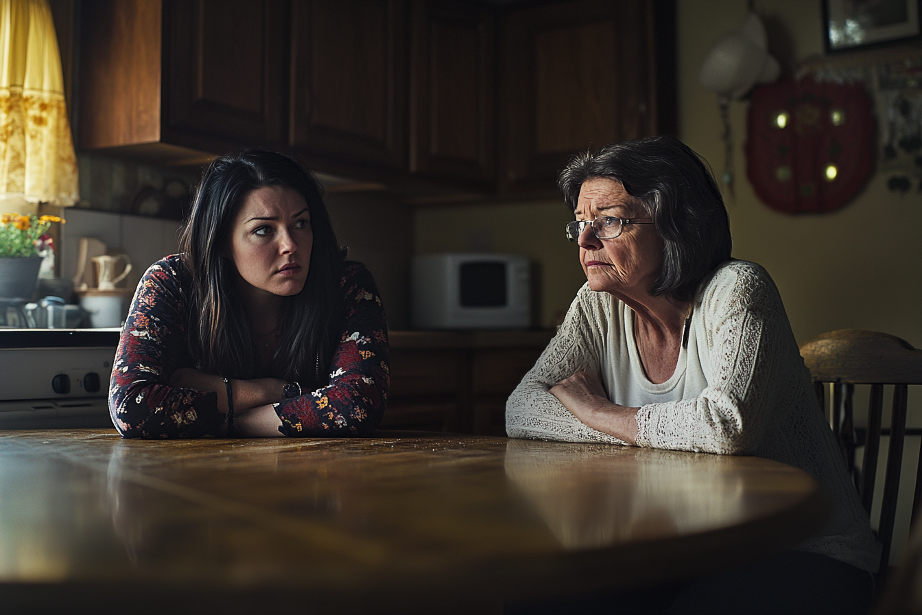 Two women sitting at a kitchen table | Source: Midjourney