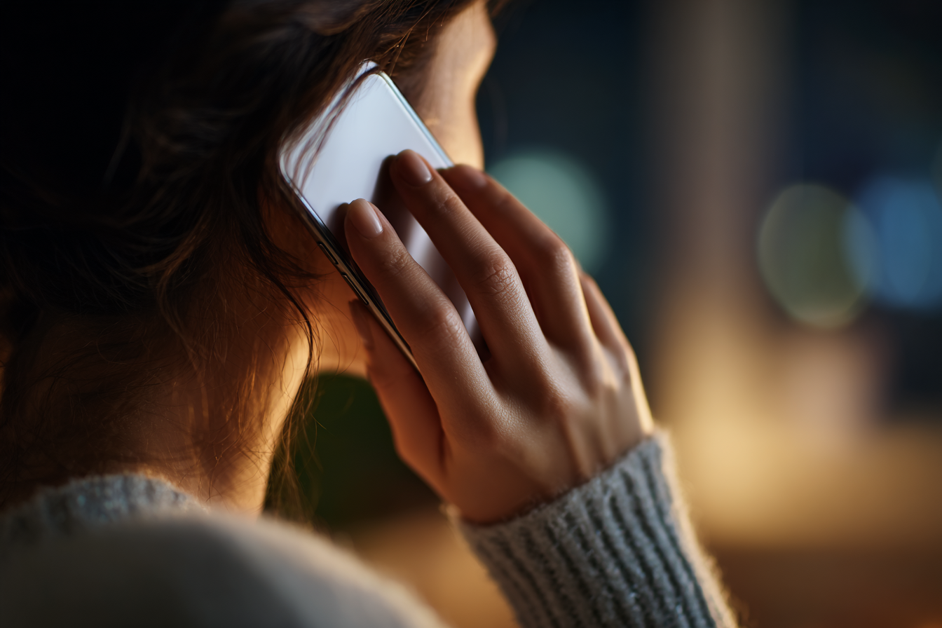 A woman talking on the phone | Source: Midjourney