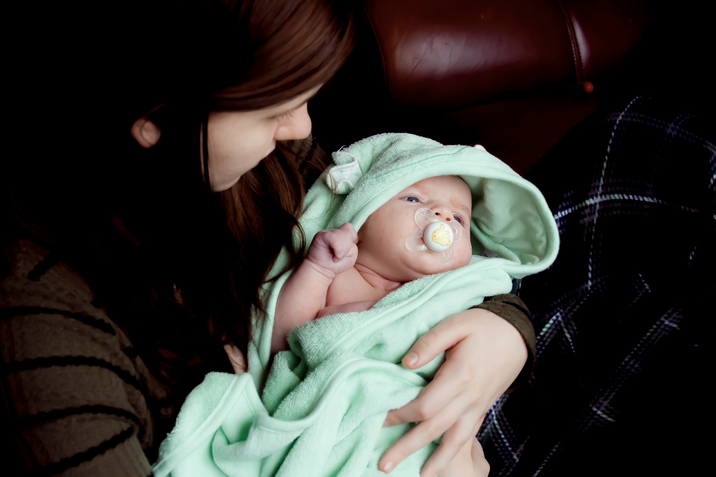 A woman holding a newborn baby | Source: Unsplash