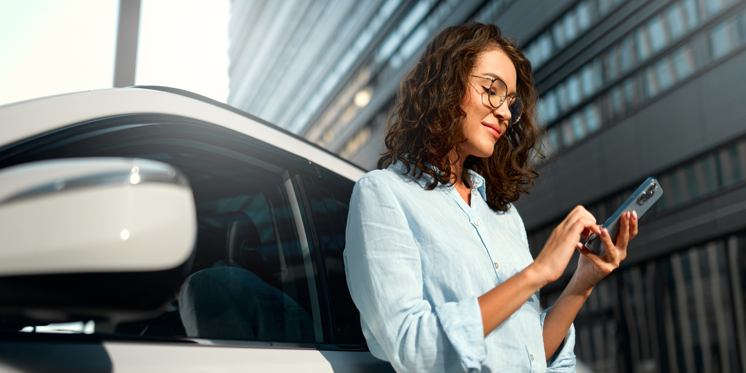 A woman using her phone | Source: Shutterstock