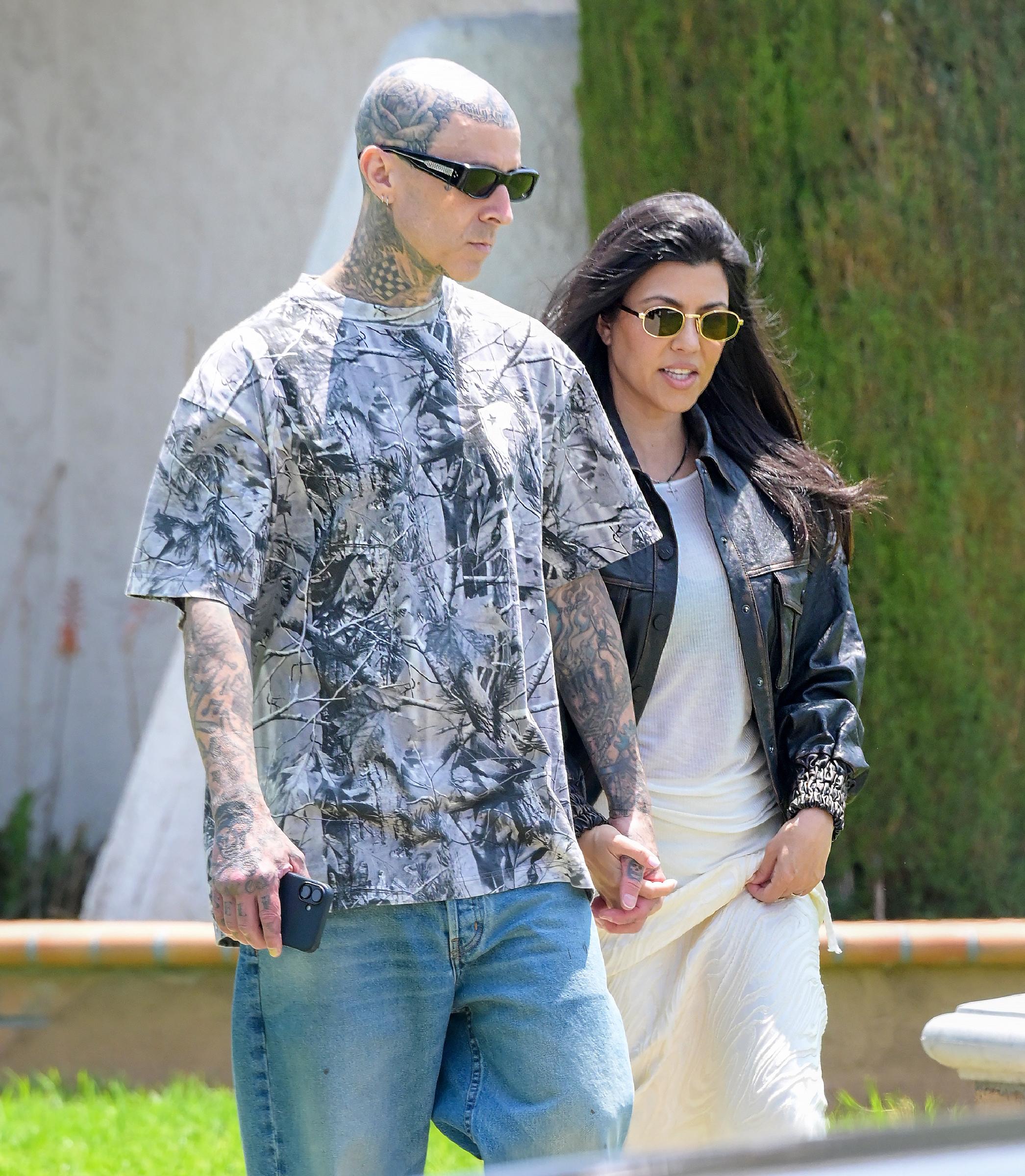 Travis Barker and Kourtney Kardashian Barker seen in Fontana, California, on June 8, 2025. | Source: Getty Images