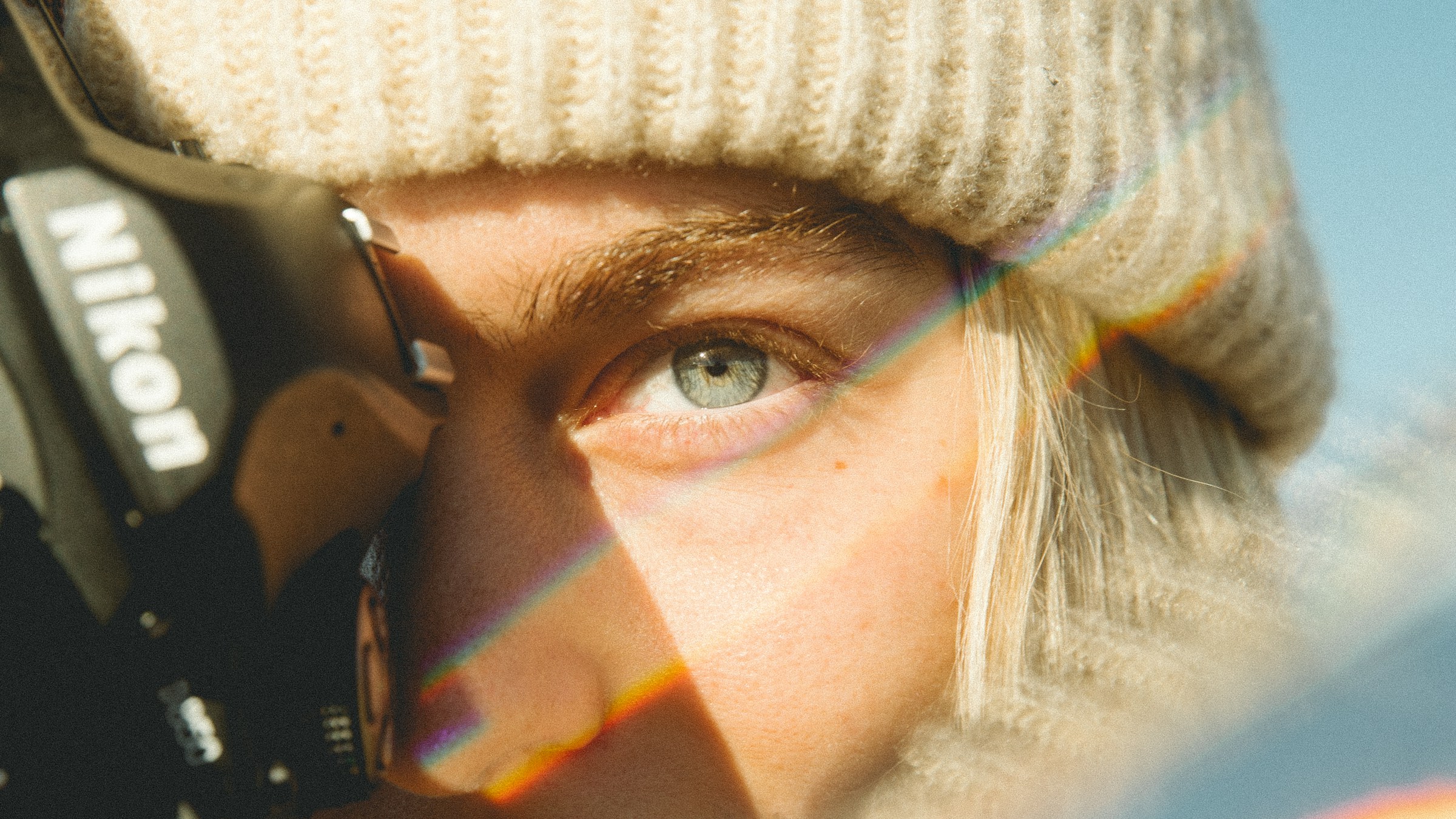 A close-up shot of a woman holding a camera | Source: Unsplash