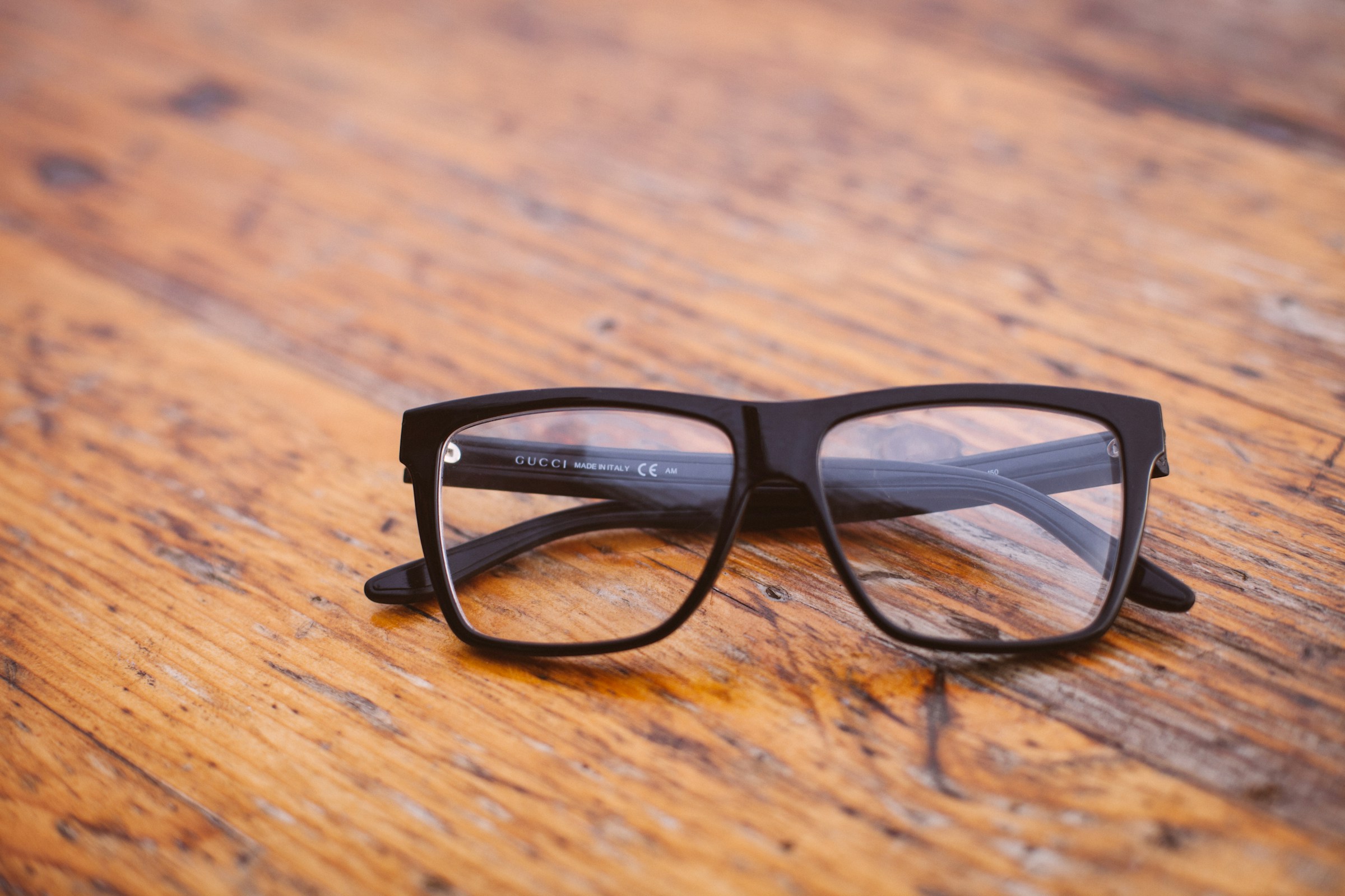 A pair of glasses on a table | Source: Unsplash