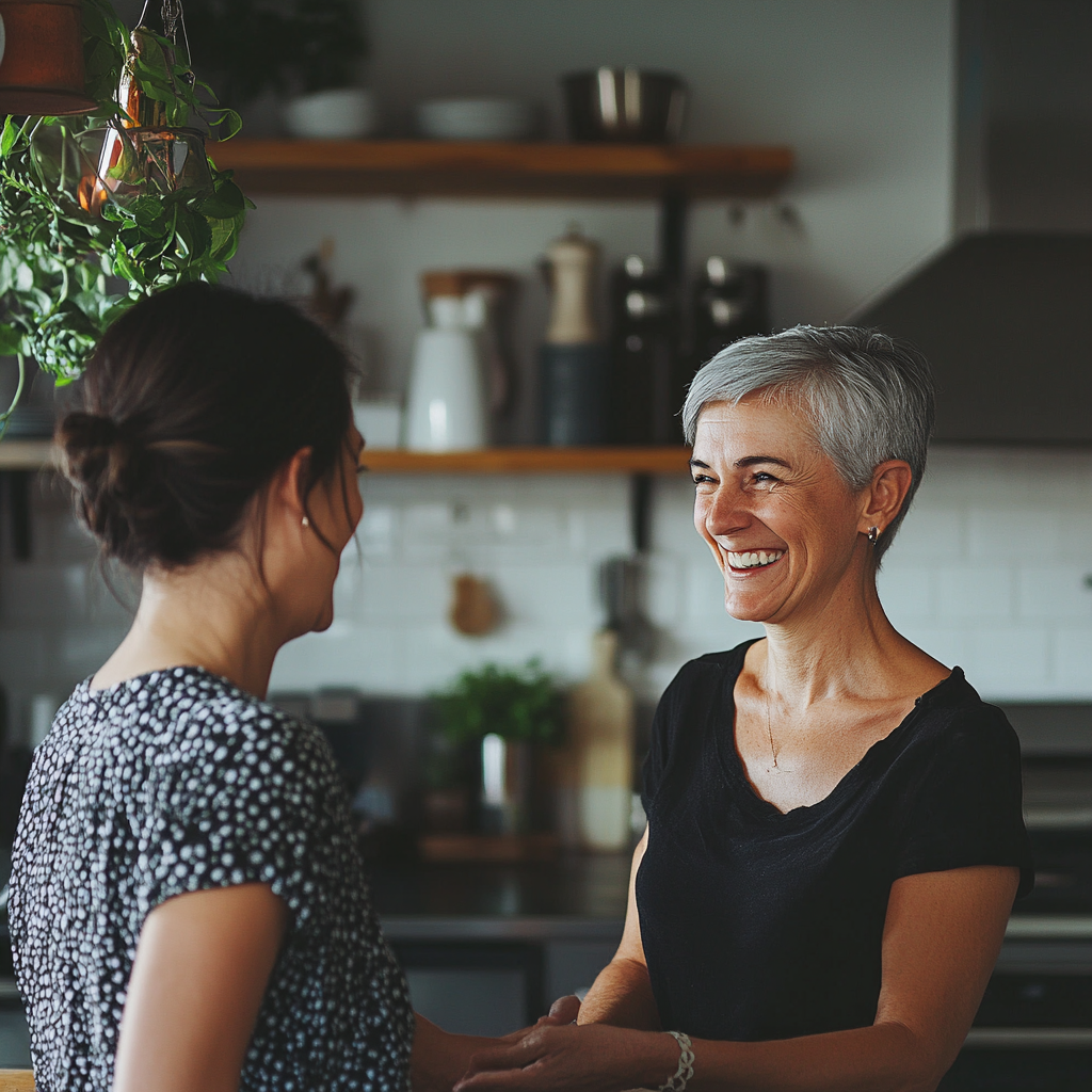 Two women smiling at each other | Source: Midjourney