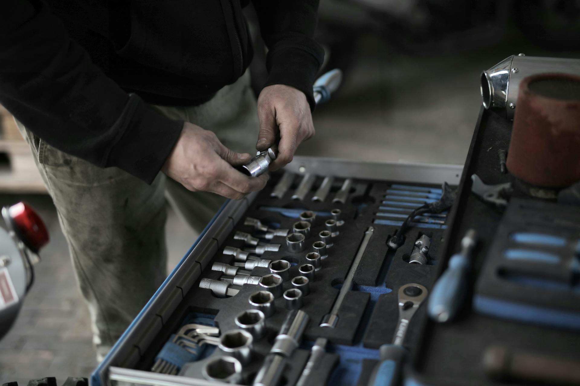 A man standing near a toolbox | Source: Pexels