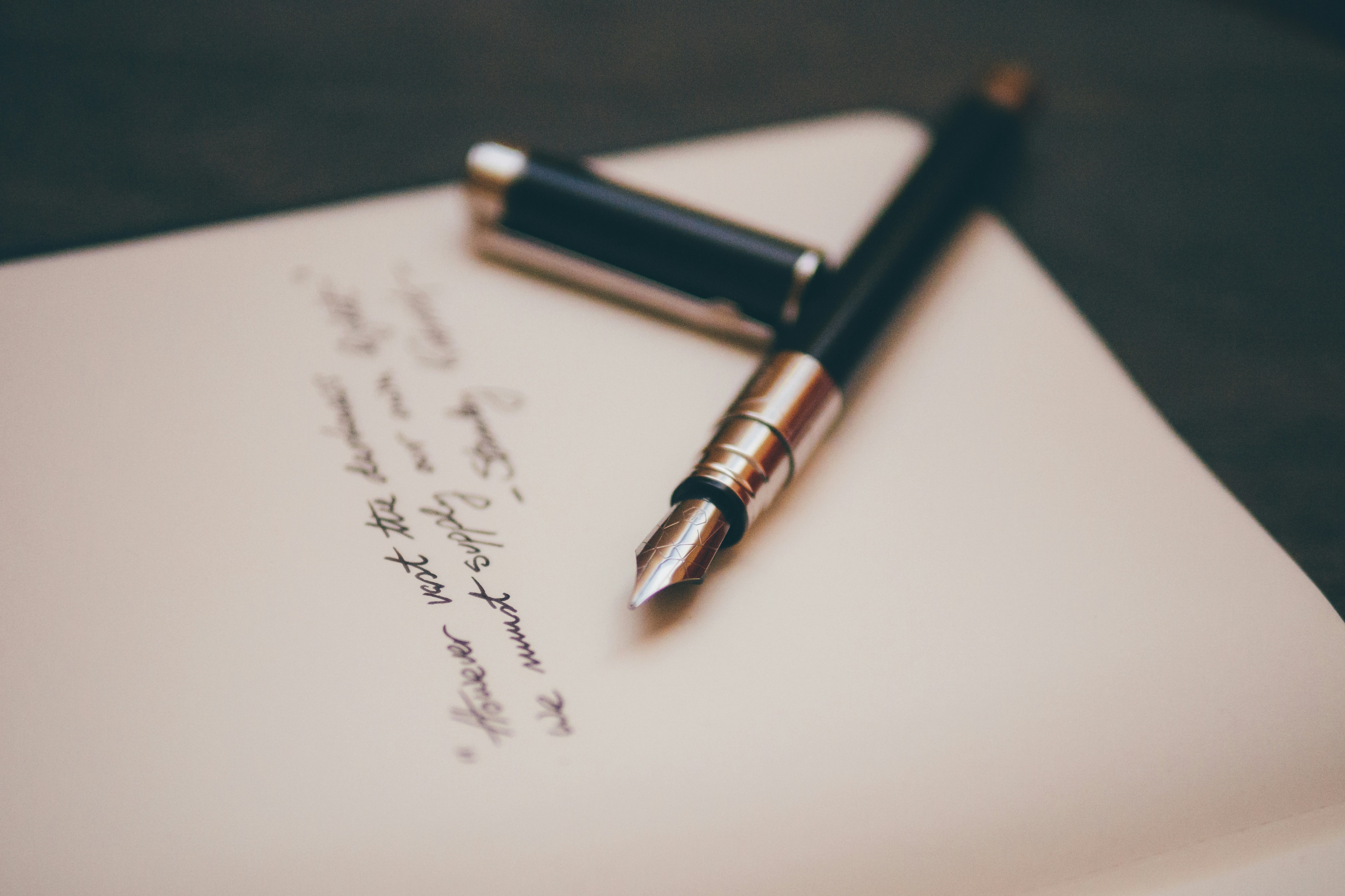 A pen on a handwritten note | Source: Unsplash