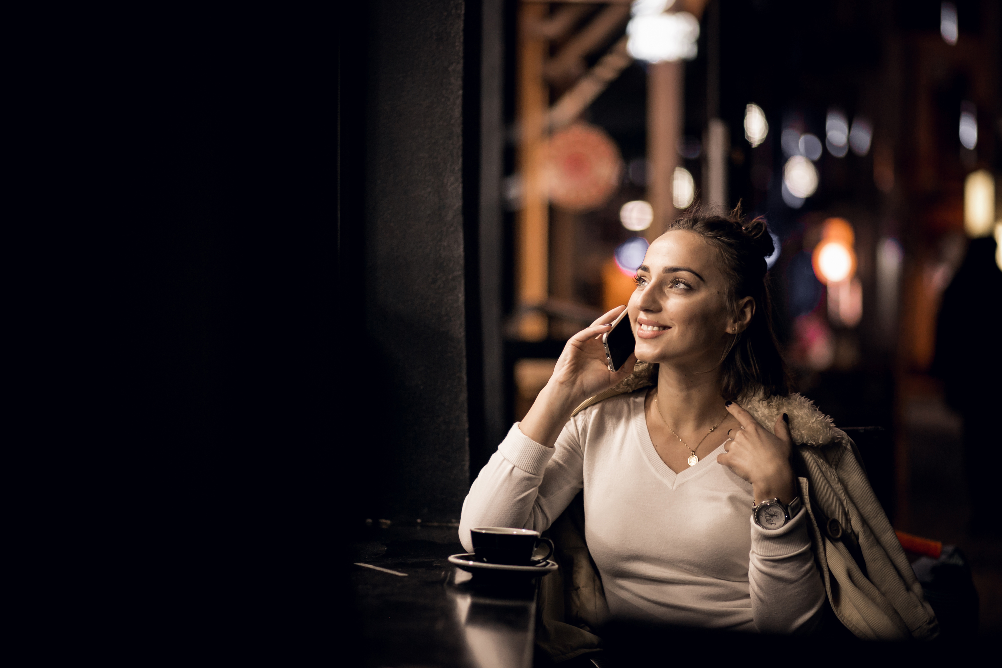 A happy woman on a call | Source: Freepik