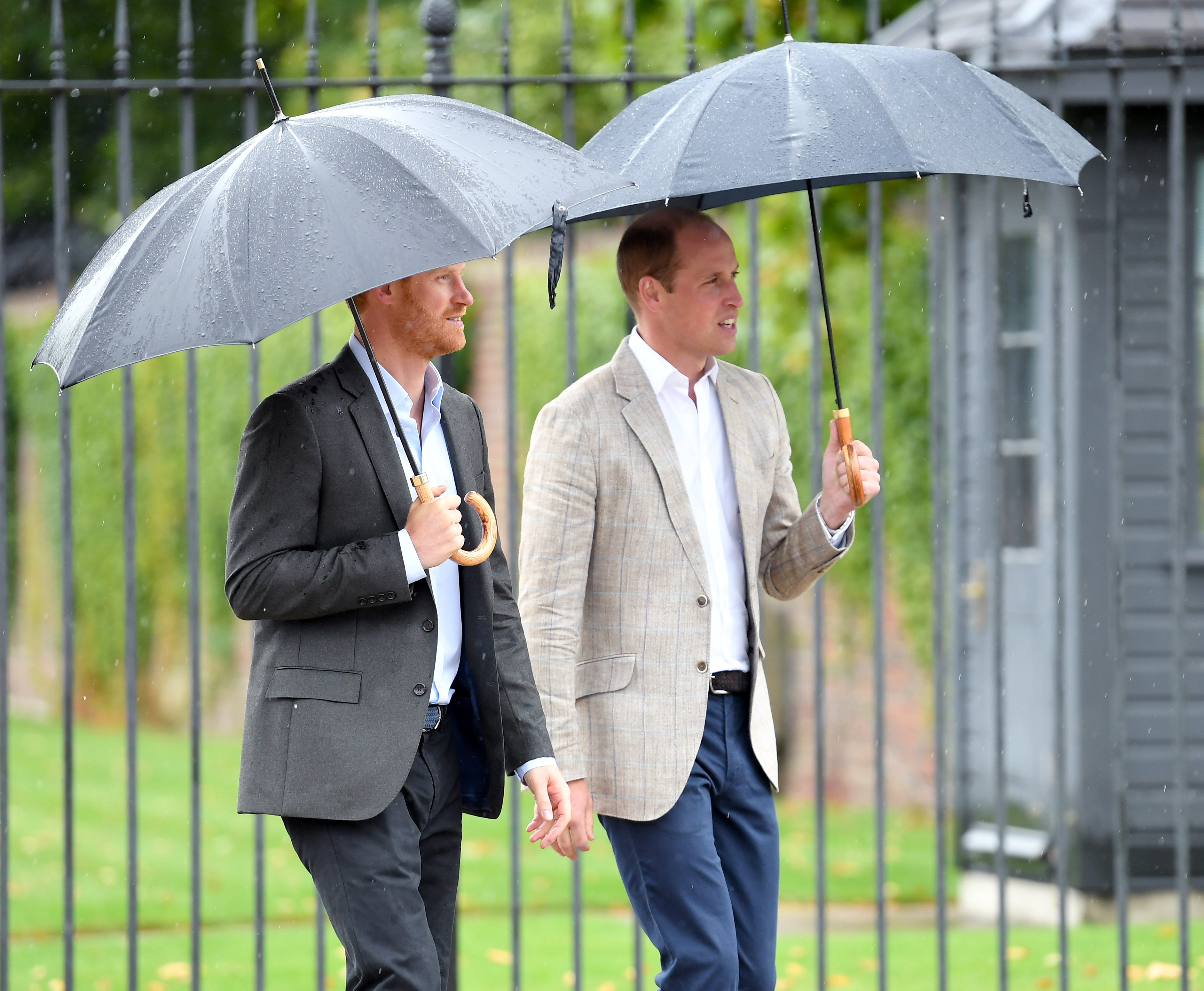 Prince Harry and Prince William meet well wishers and views tributes to Princeess Diana after a visit to The Sunken Garden at Kensington Palace on August 30, 2017 in London, England. | Source: Getty Images