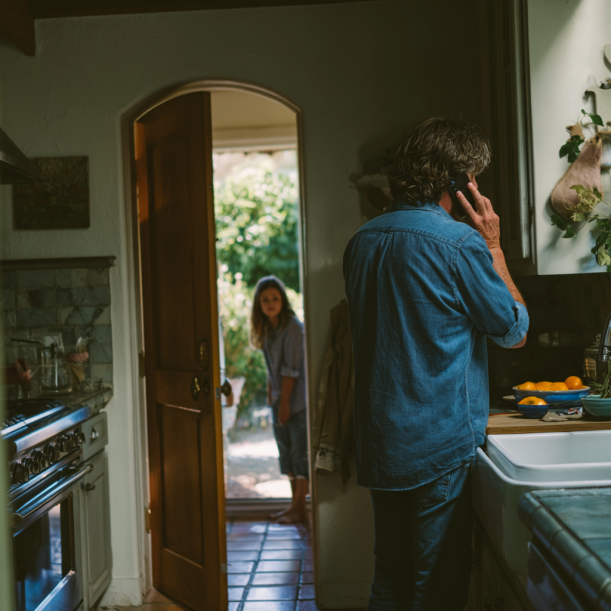 A man talks on the phone as his daughter listens in | Source: Midjourney