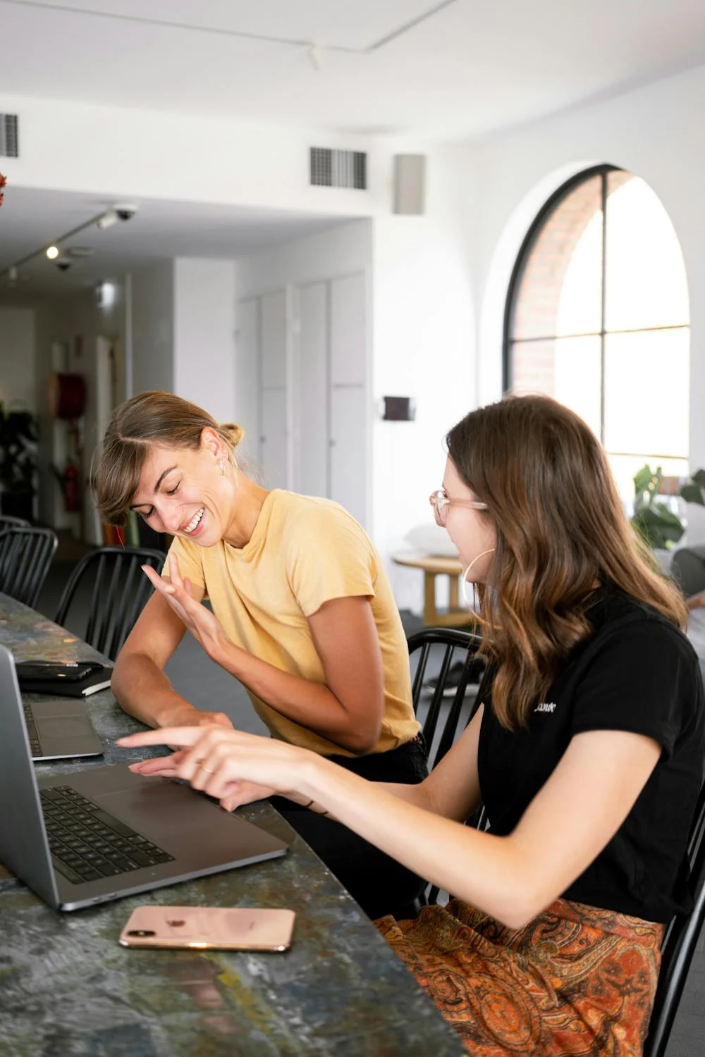 Smiling women in their office | Source: Pexels