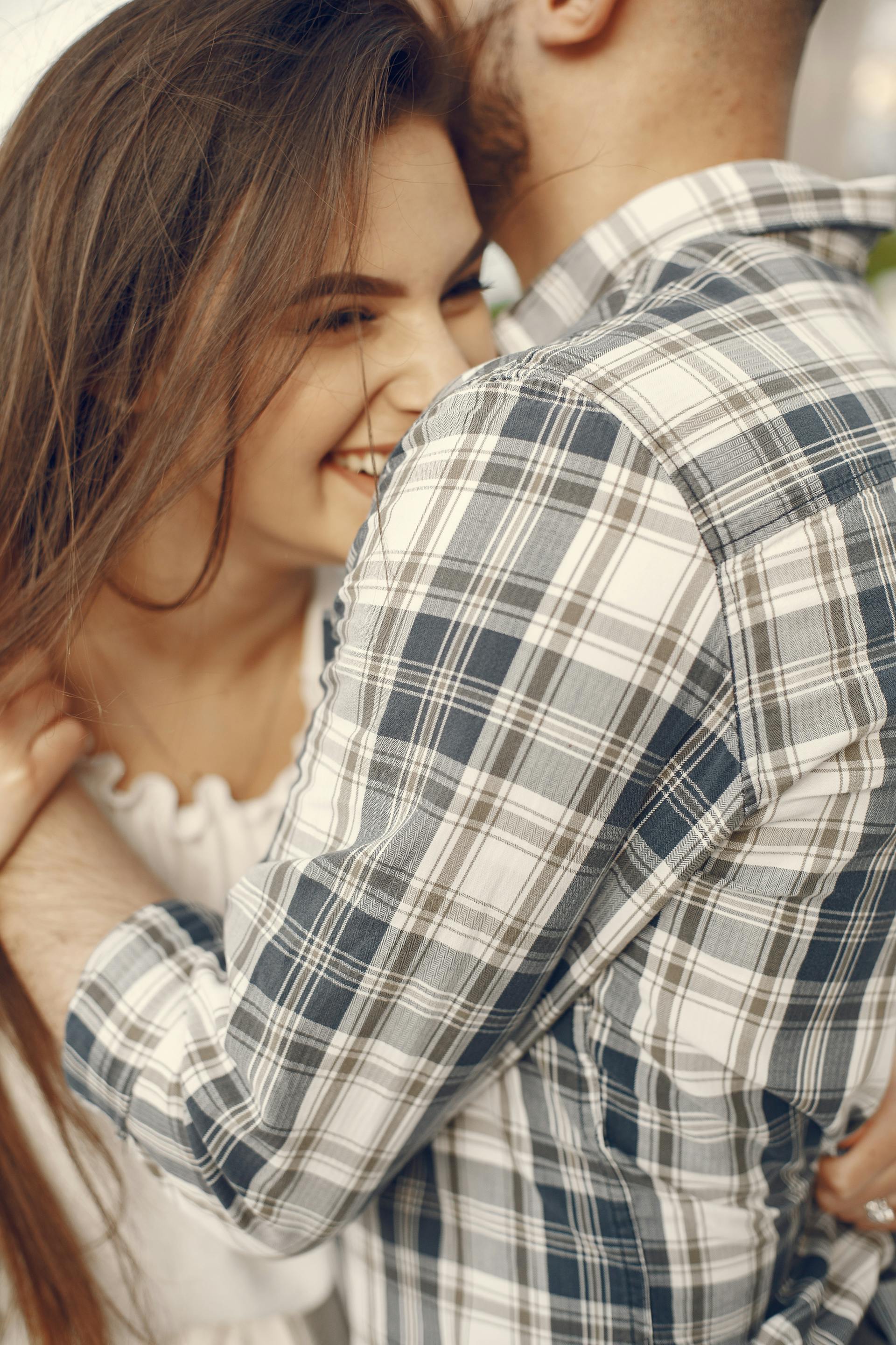 A close-up shot of a couple sharing a hug | Source: Pexels