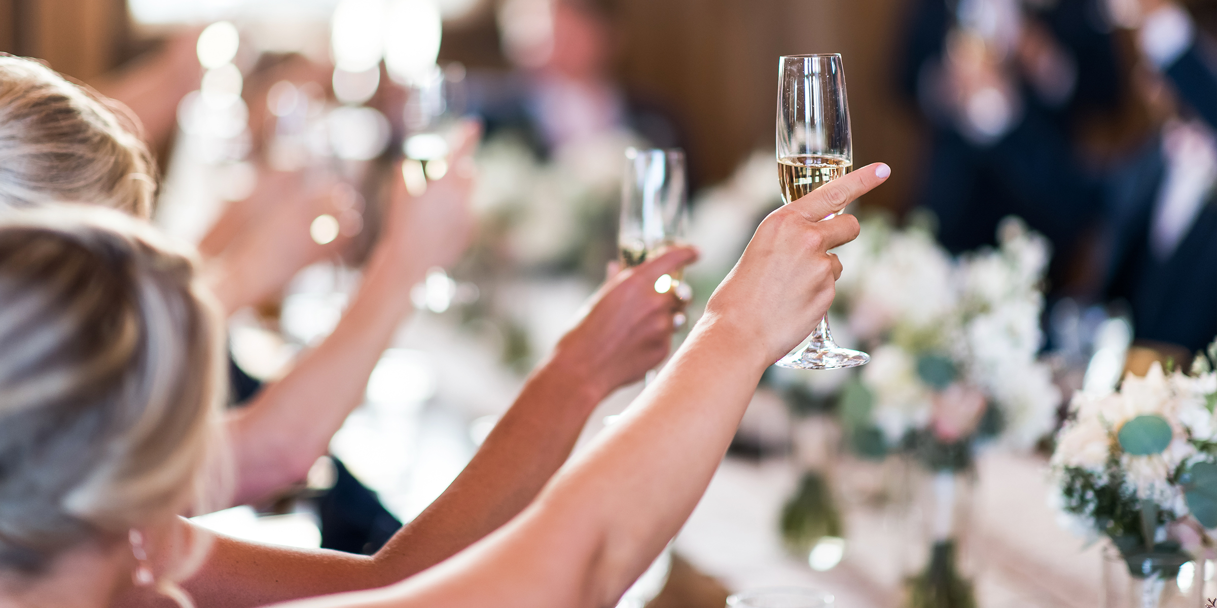 Guests toasting during the wedding reception | Source: Shutterstock