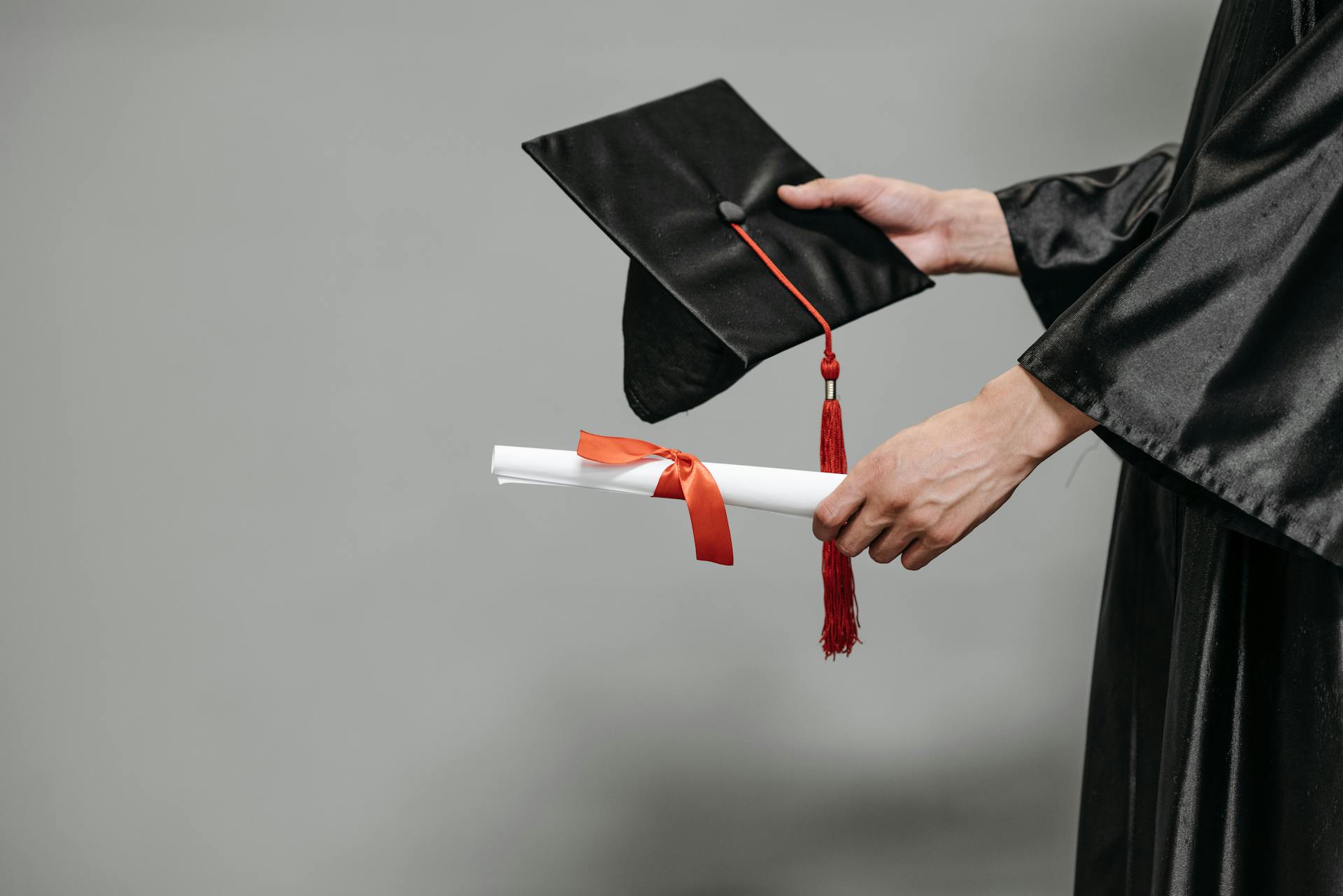 A person holding their graduation cap | Source: Pexels