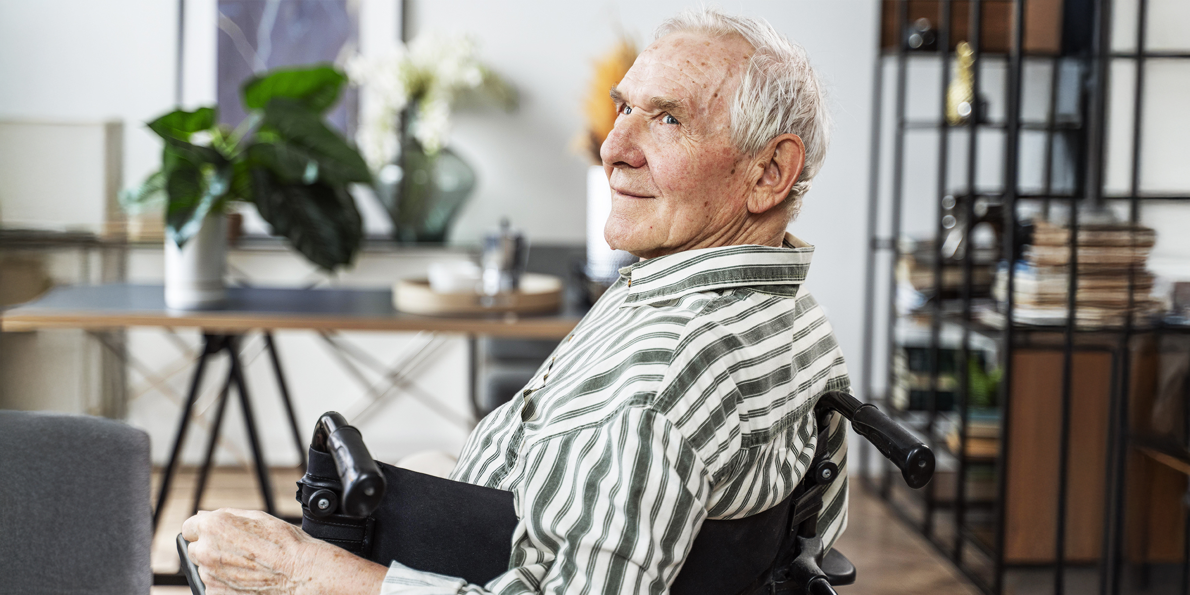 An older man sitting in a wheelchair | Souce: Freepik