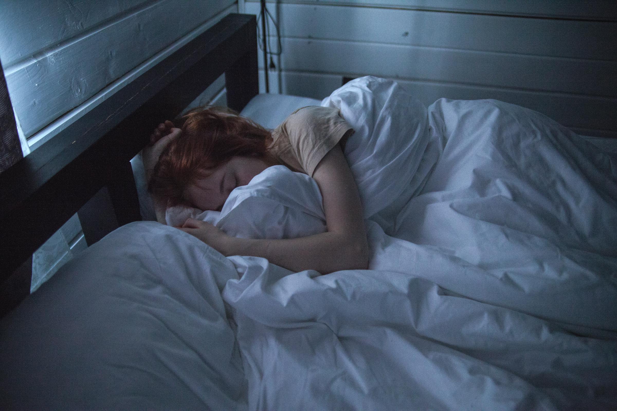 A woman sleeping in bed | Source: Pexels