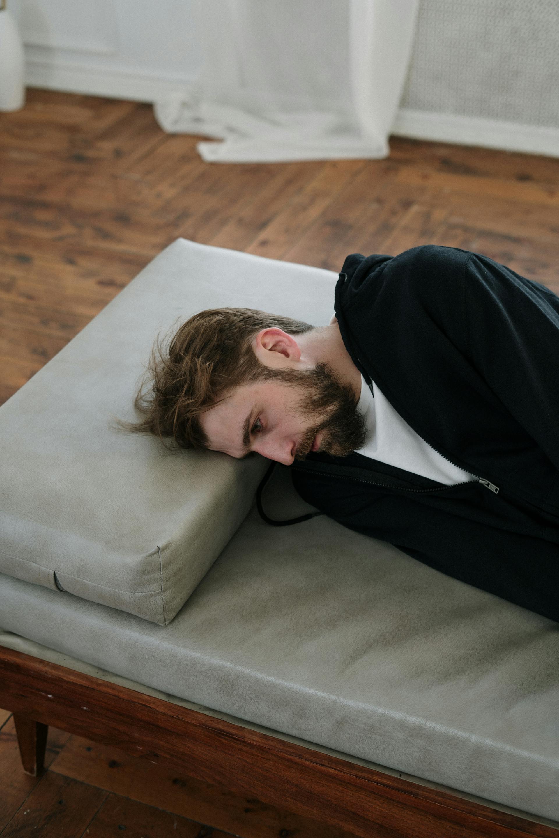 A man lying on a sofa | Source: Pexels