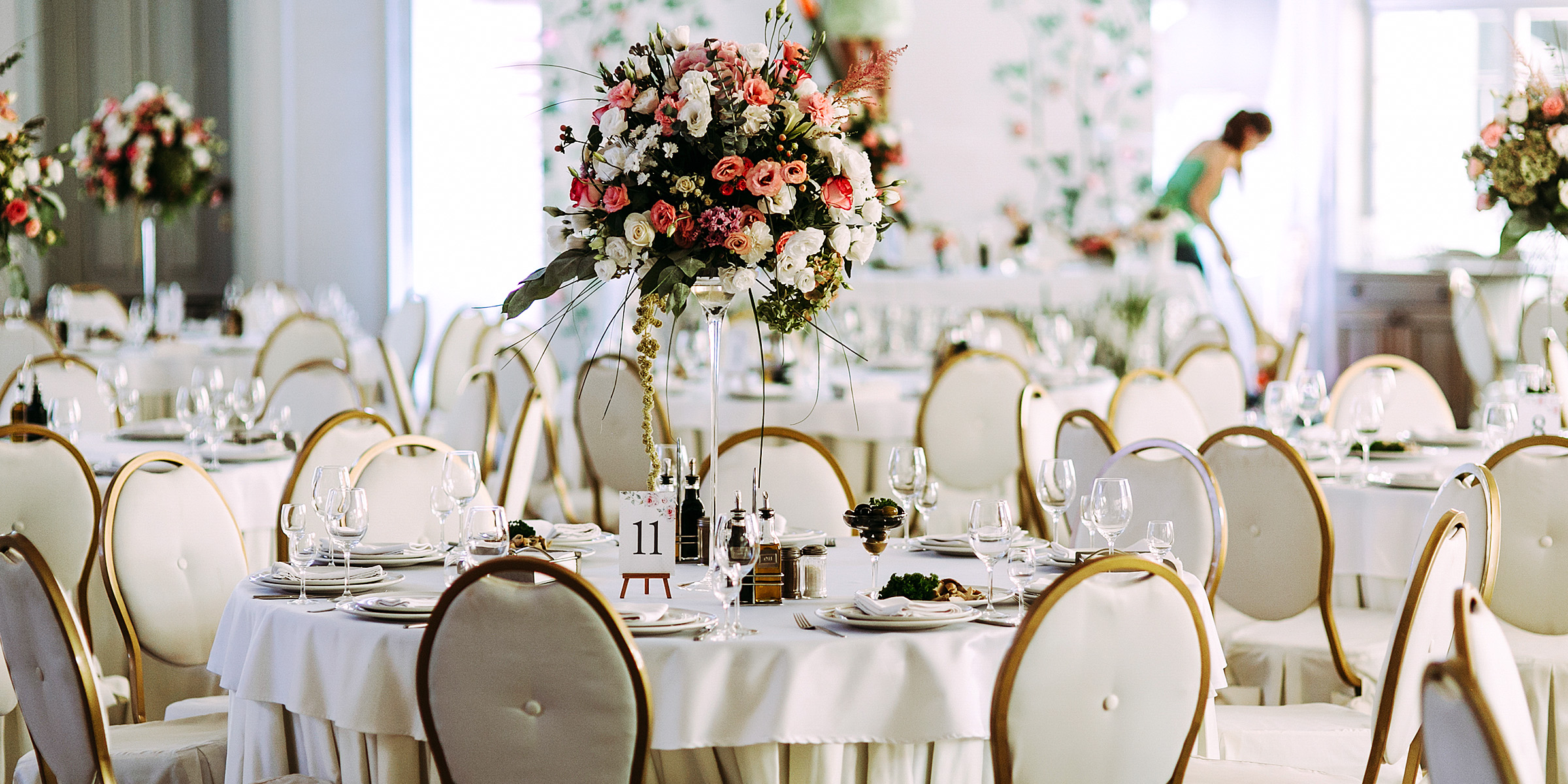 Set tables at a wedding venue | Source: Shutterstock