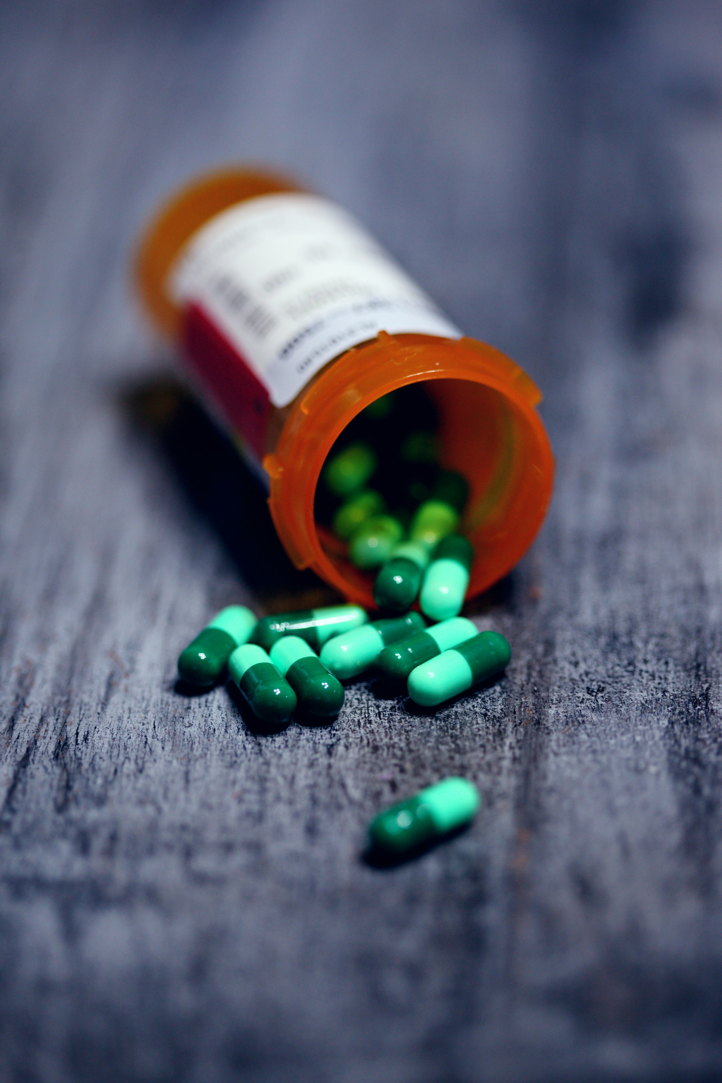A bottle of prescription medicine with capsules | Source: Unsplash