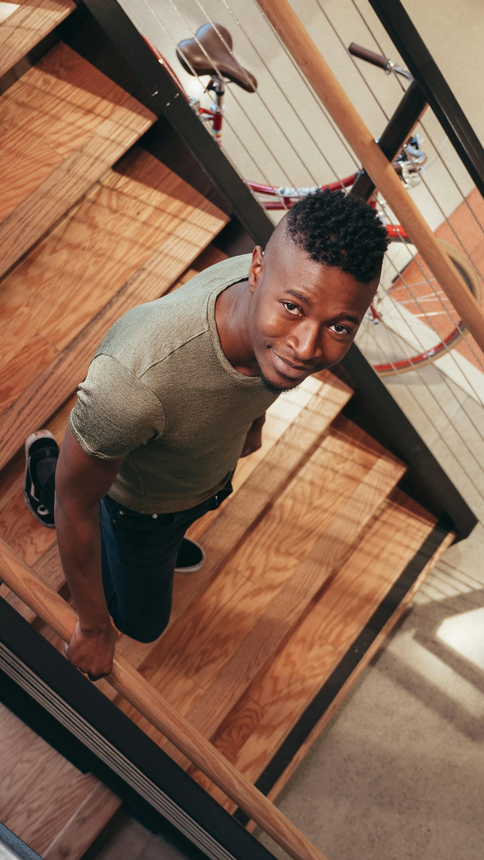 A happy man walking down stairs | Source: Pexels