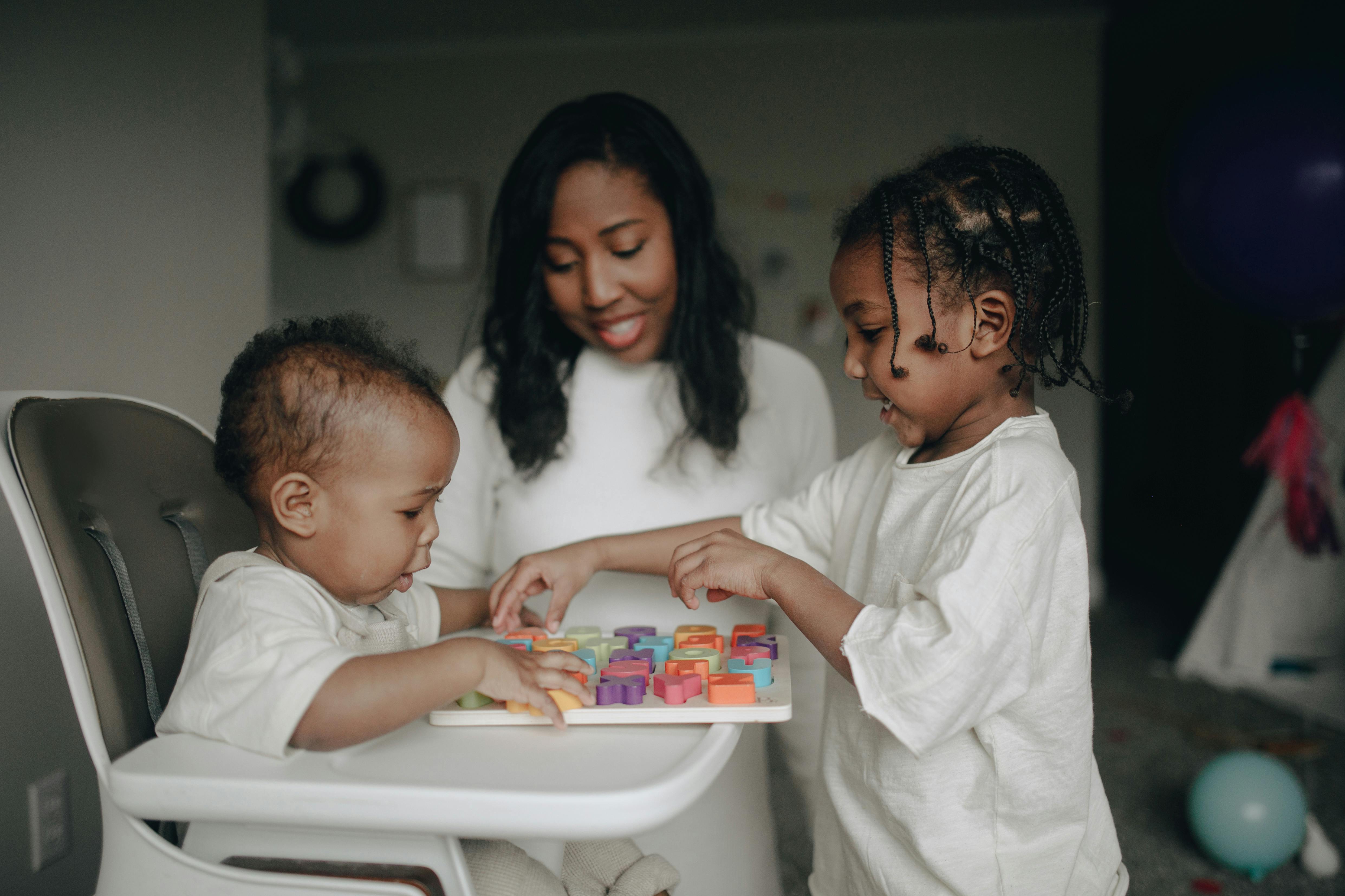 A mother with two children | Source: Pexels