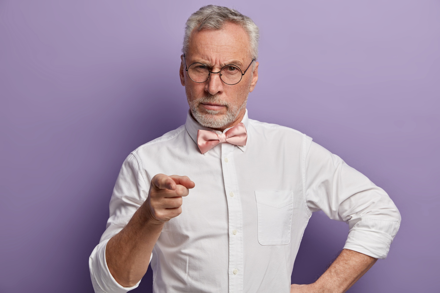 An annoyed man pointing his finger at someone | Source: Freepik