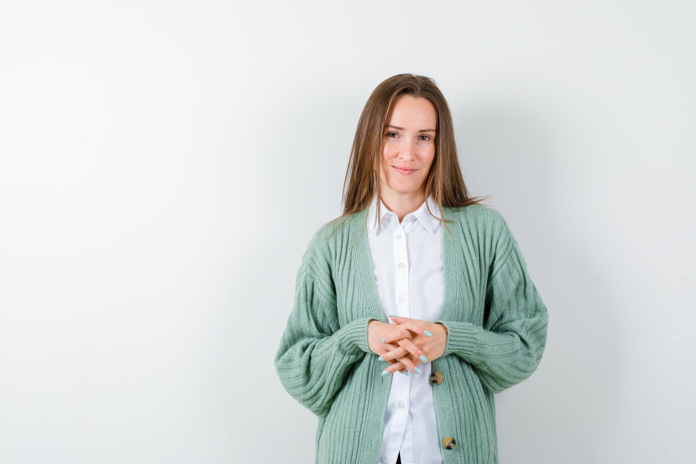 A woman smiling politely | Source: Freepik